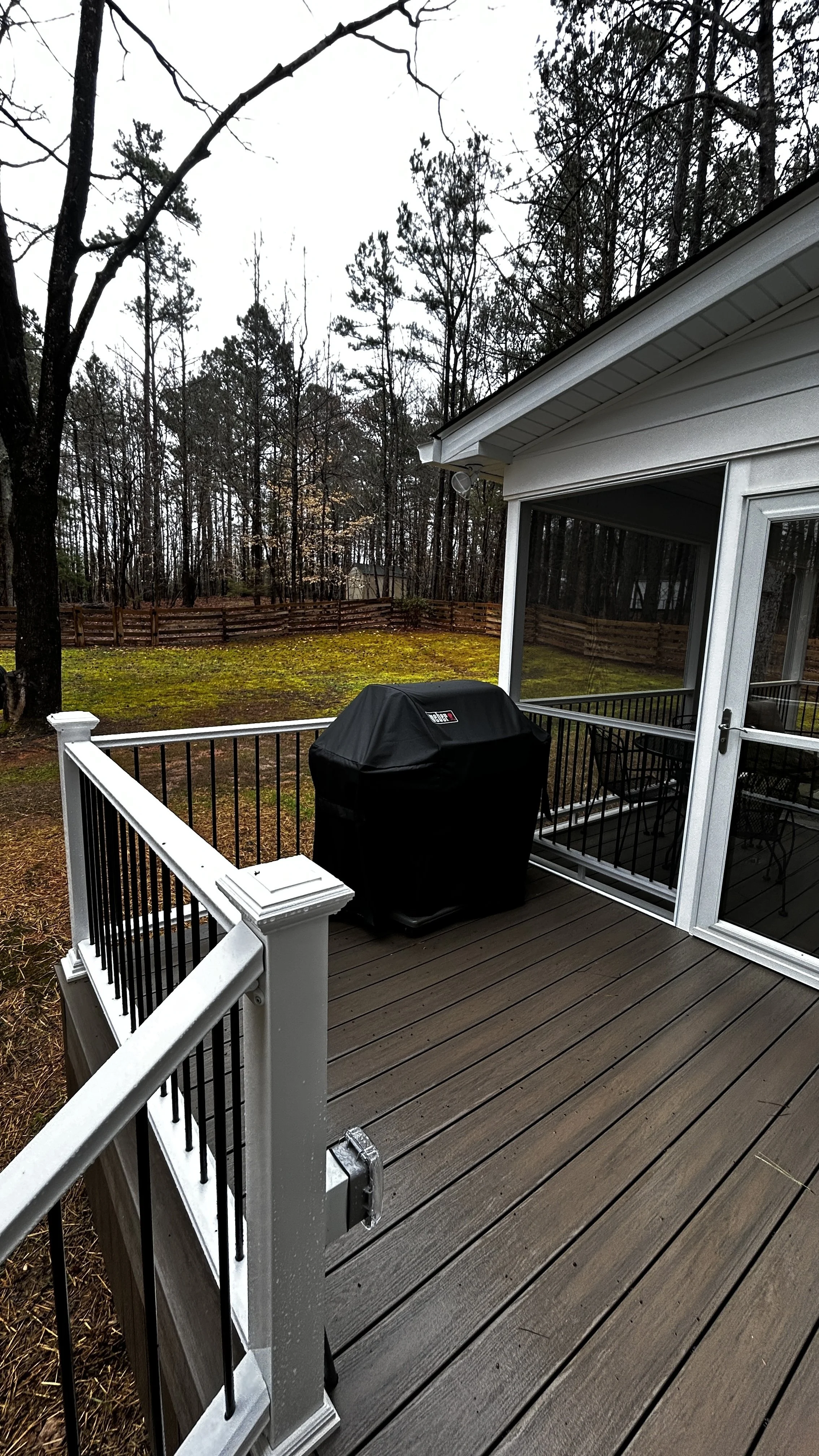 12 x 16 composite grilling deck built in Wake Forest, NC. Using durable composite decking and low maintenance vinyl rails with aluminum pickets ensures many years of beauty. This deck also features our skirting package which is a great way to enclose