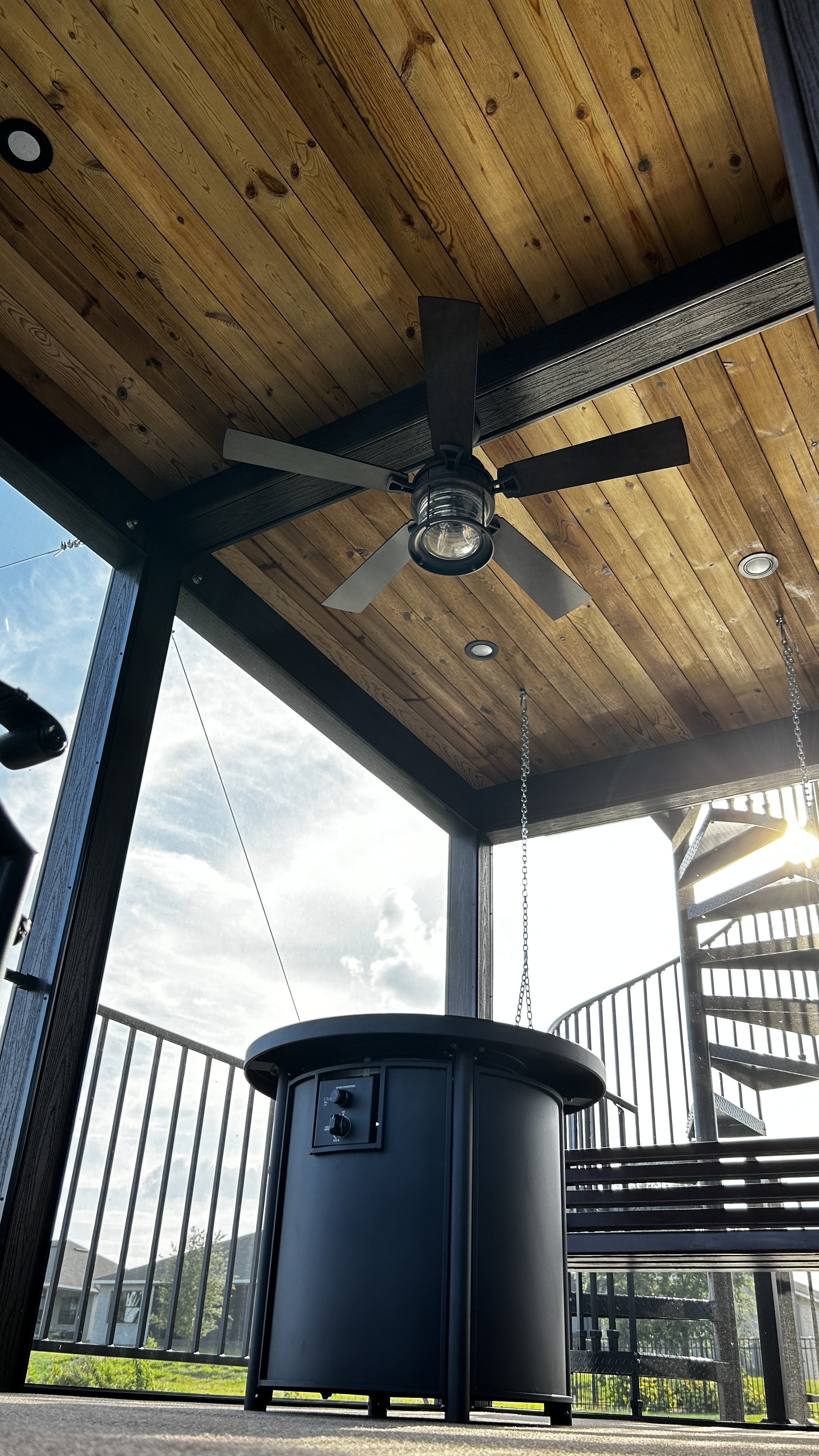Moody Deck on Dock: Trex Decking, Spiral Staircase, & Lighting | Fortress Railing | ScreenEZE Screens