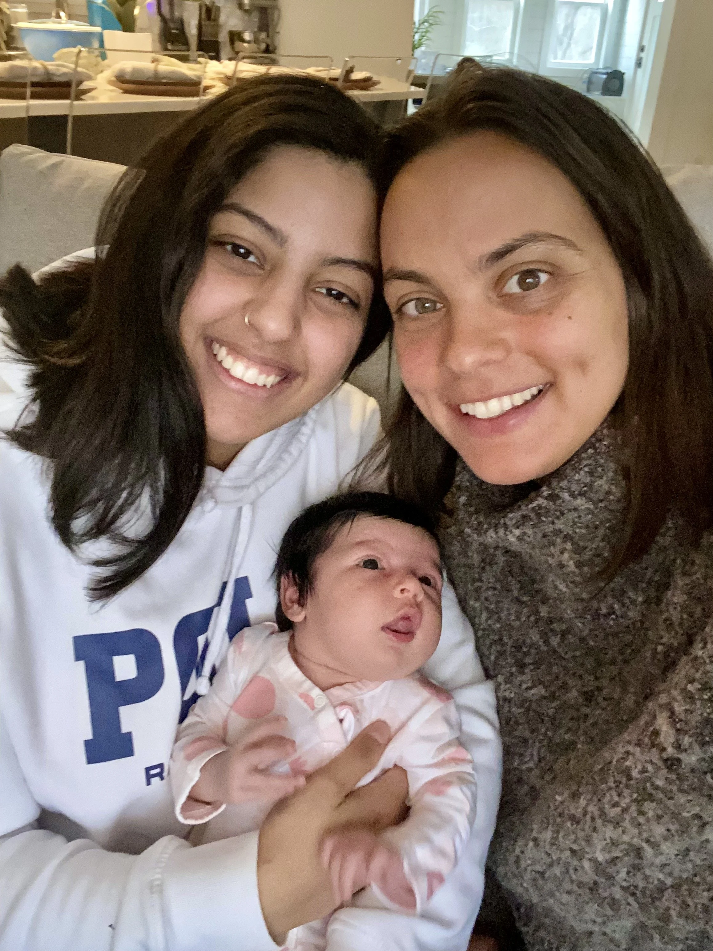 Mom with Postpartum Doula and her newborn baby