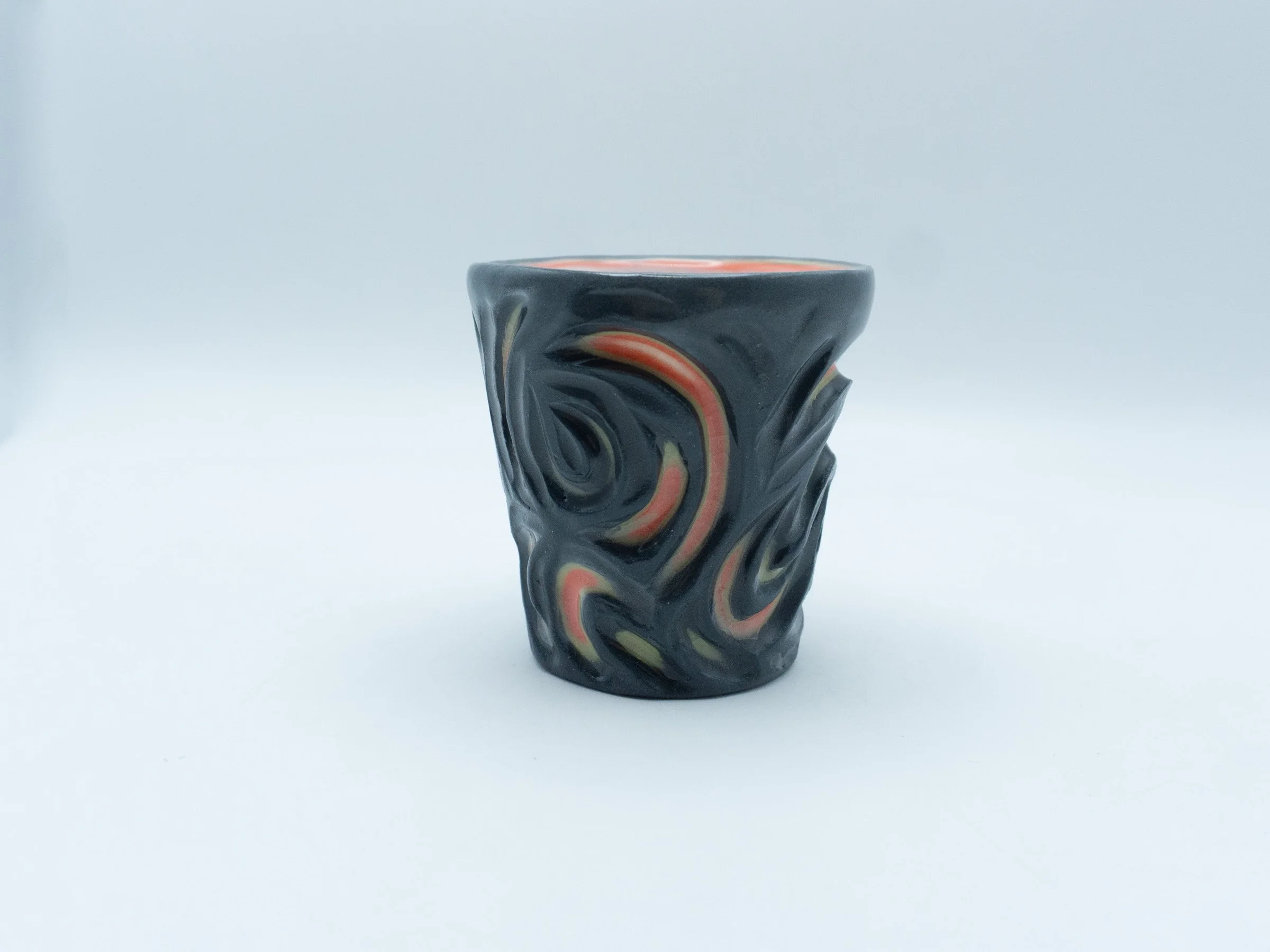 black and orange swirls design/multi-layered slip cast and carved cup- 2025-2½x2½x2½
