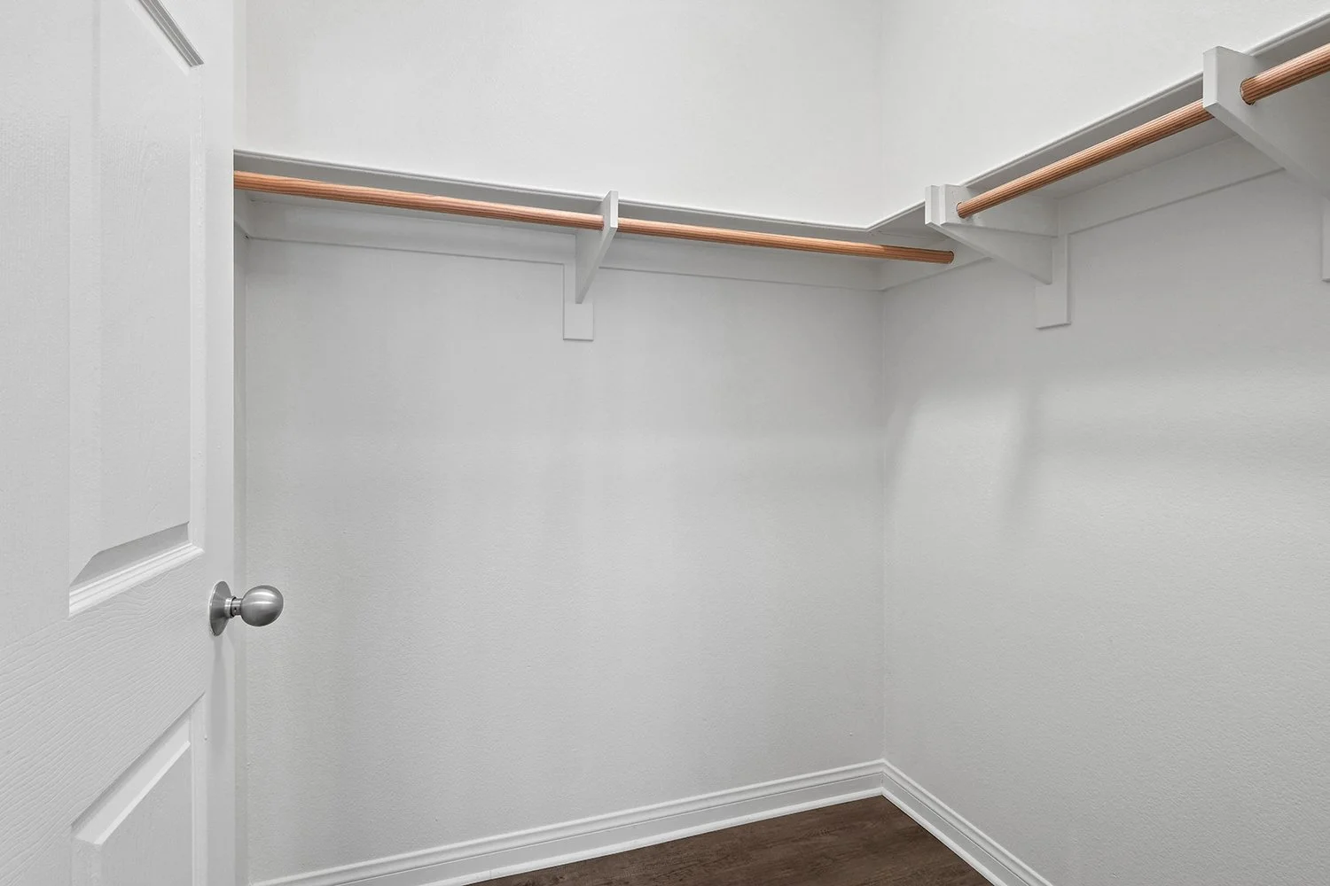  Spacious closet in bedroom at Crescent Heights with built in shelves and hanging rods 