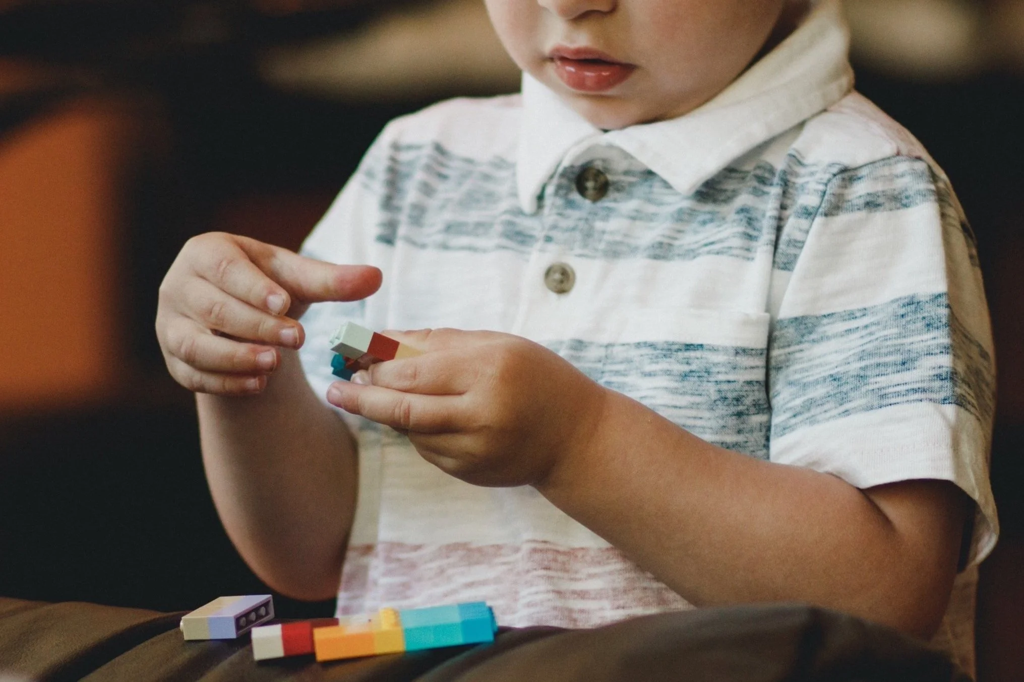 child with autism playing during developmental therapy activity
