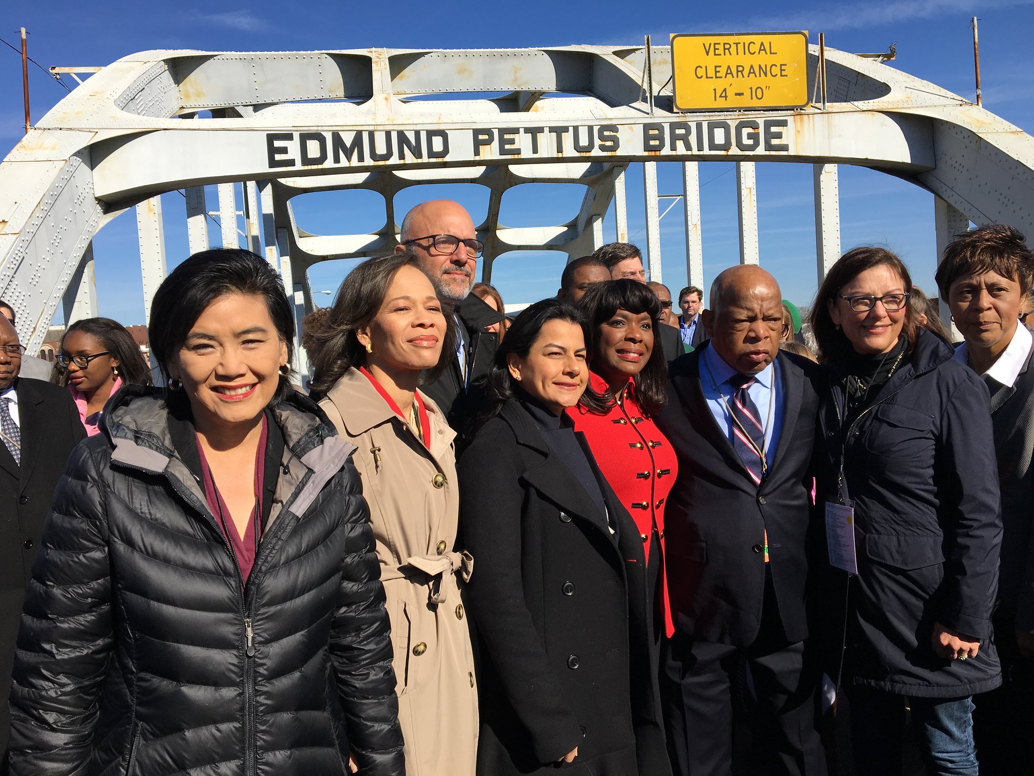Rep. Judy Chu marching on the Edmund Pettus Bridge with John Lewis on a pilgrimage to Selma, Alabama