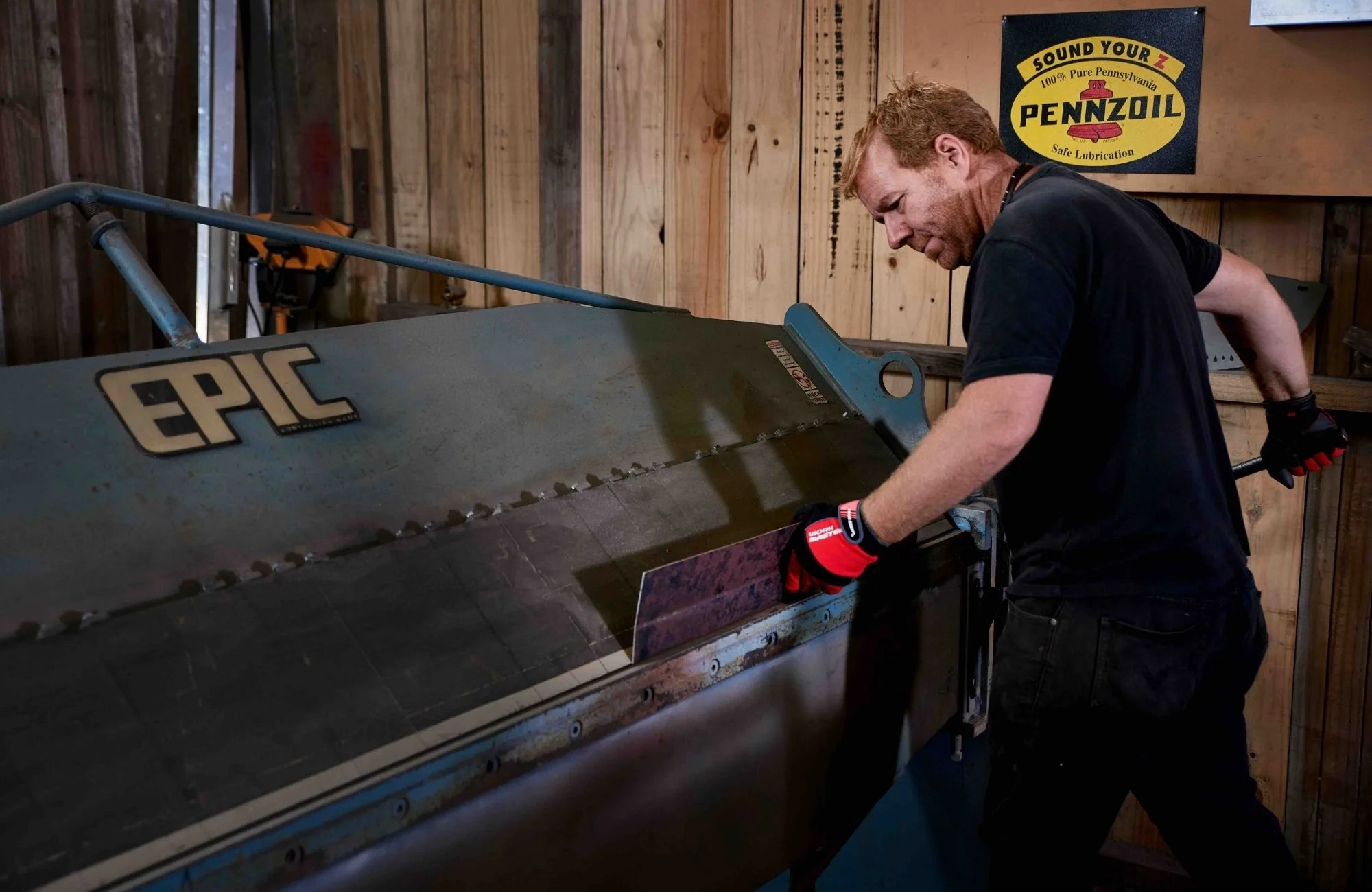 fabricator carefully working with steel