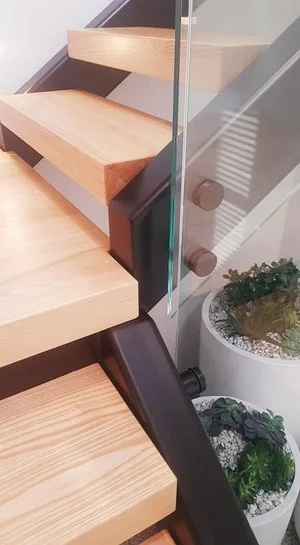 steel-and-timber-stairs-with-handrails-on-glass-orewa-17.jpeg