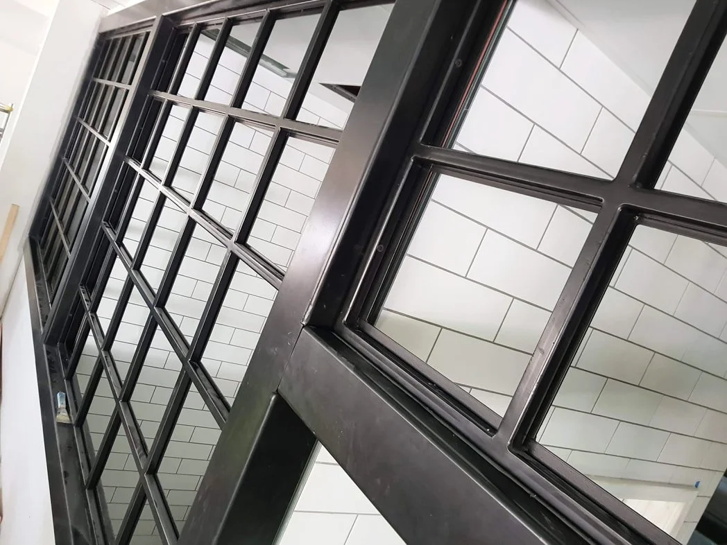 powder-coated steel window frames in black colour