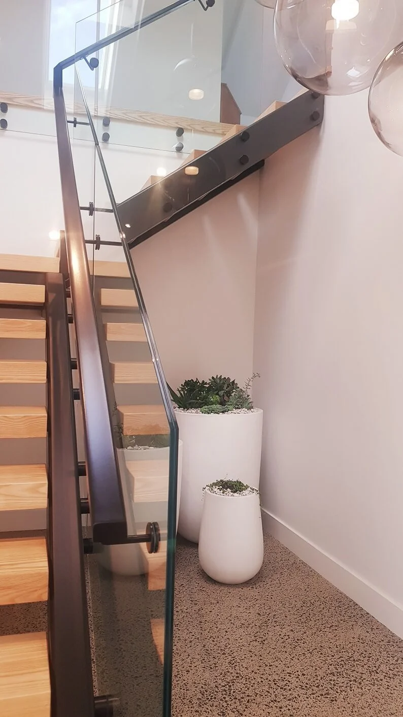 steel-and-timber-stairs-with-handrails-on-glass-orewa-21.jpg