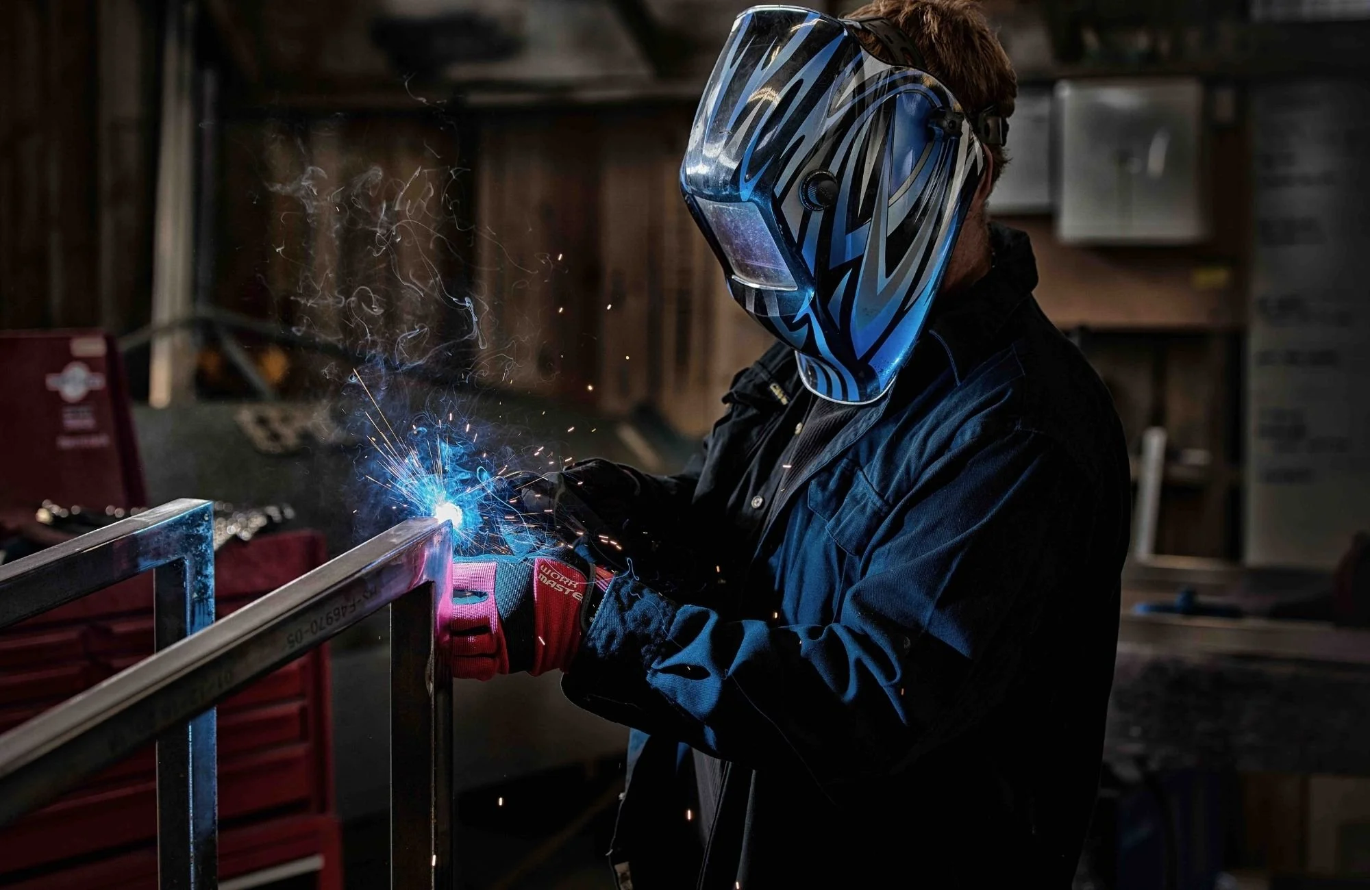 a fabricator welding metal in Silverdale workshop