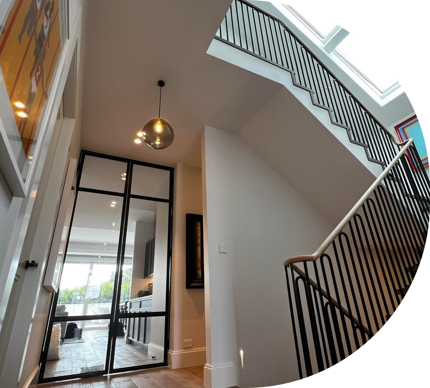 Indoor balustrades with timber handrails leading to upper storey