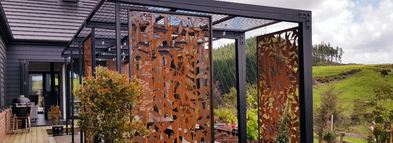 Corten steel screens situated in outdoor living space.