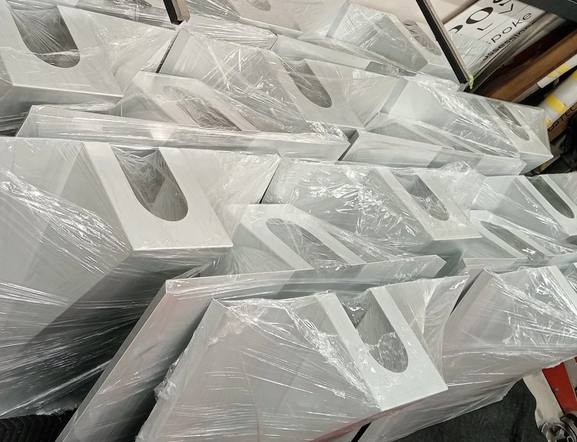 Powder-coated aluminium flashings carefully wrapped in plastic and ready for installation in Auckland CBD.jpg