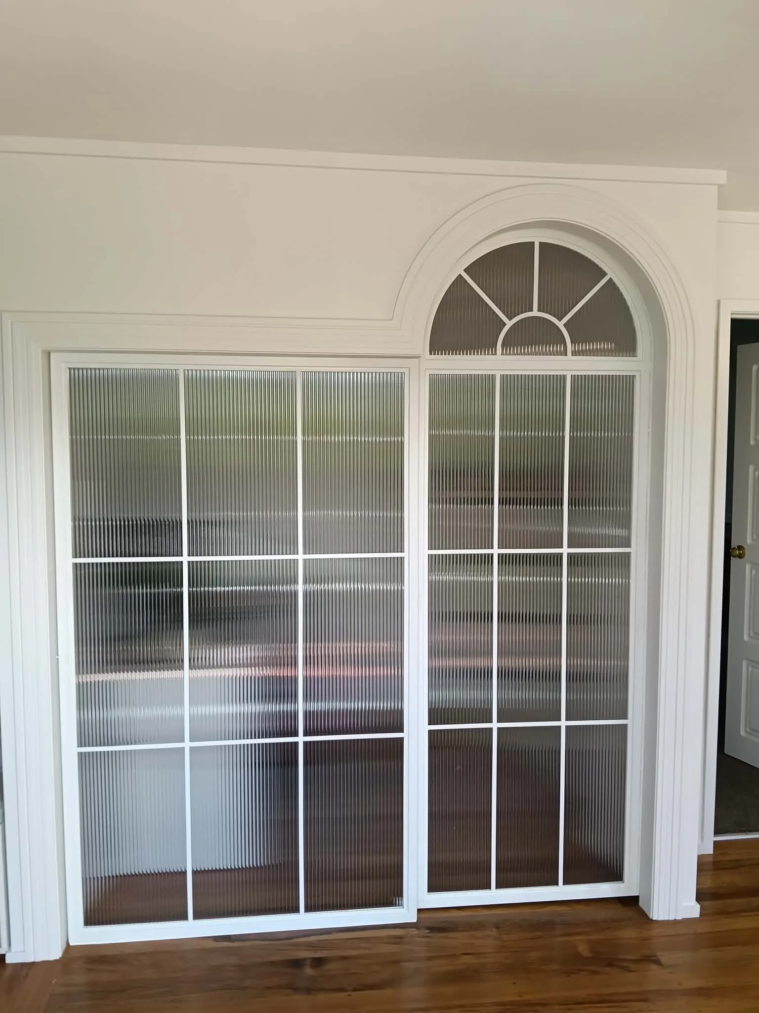 powder-coated-steel-arched-sliding-door-takapuna-jn2083.jpg