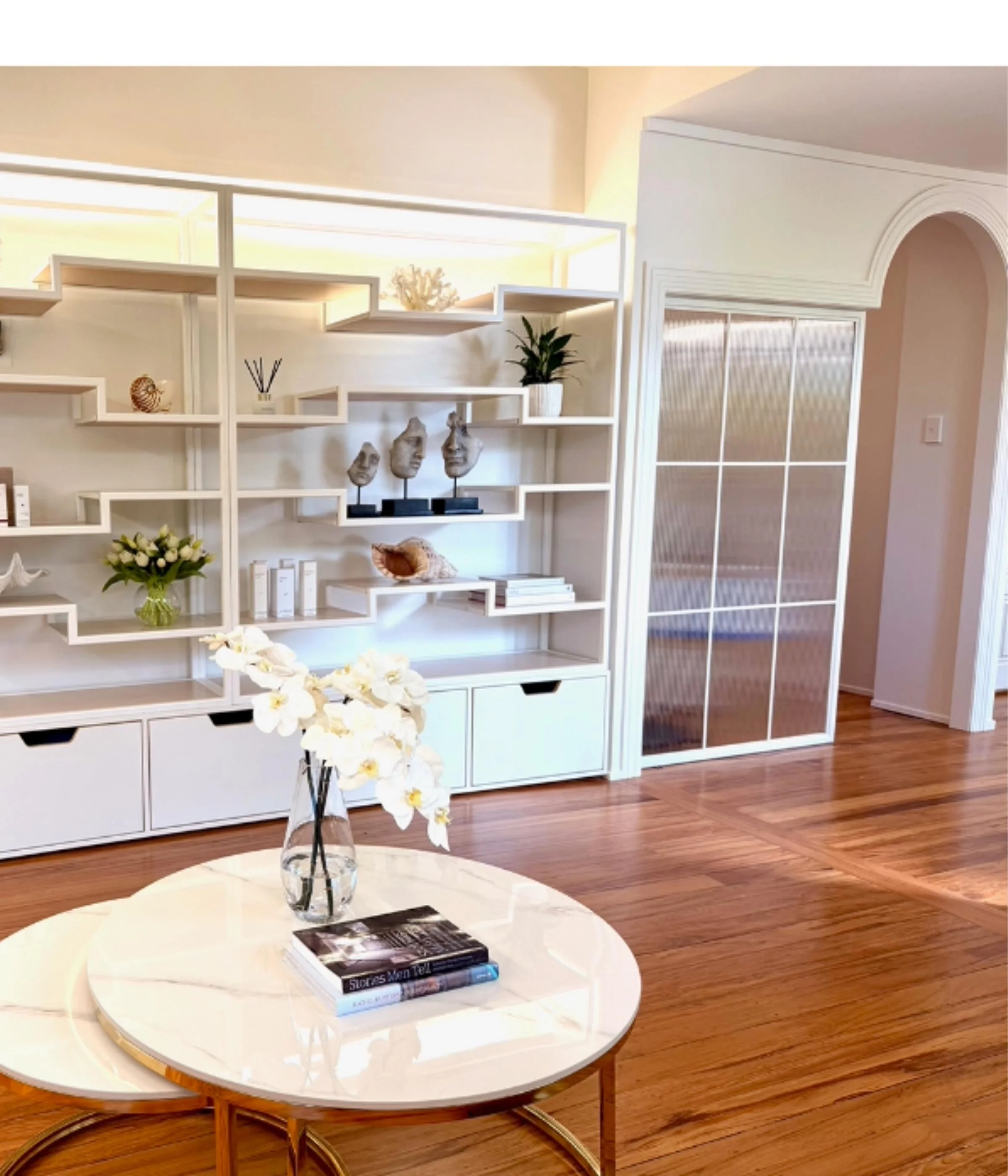 steel shelving and arched interior door powder-coated steel and fluted glass for a surgery fitout in Takapuna