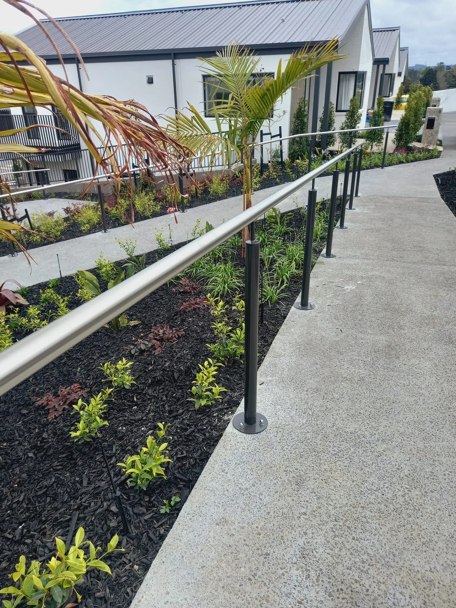 outdoor steel handrails around residential walkway