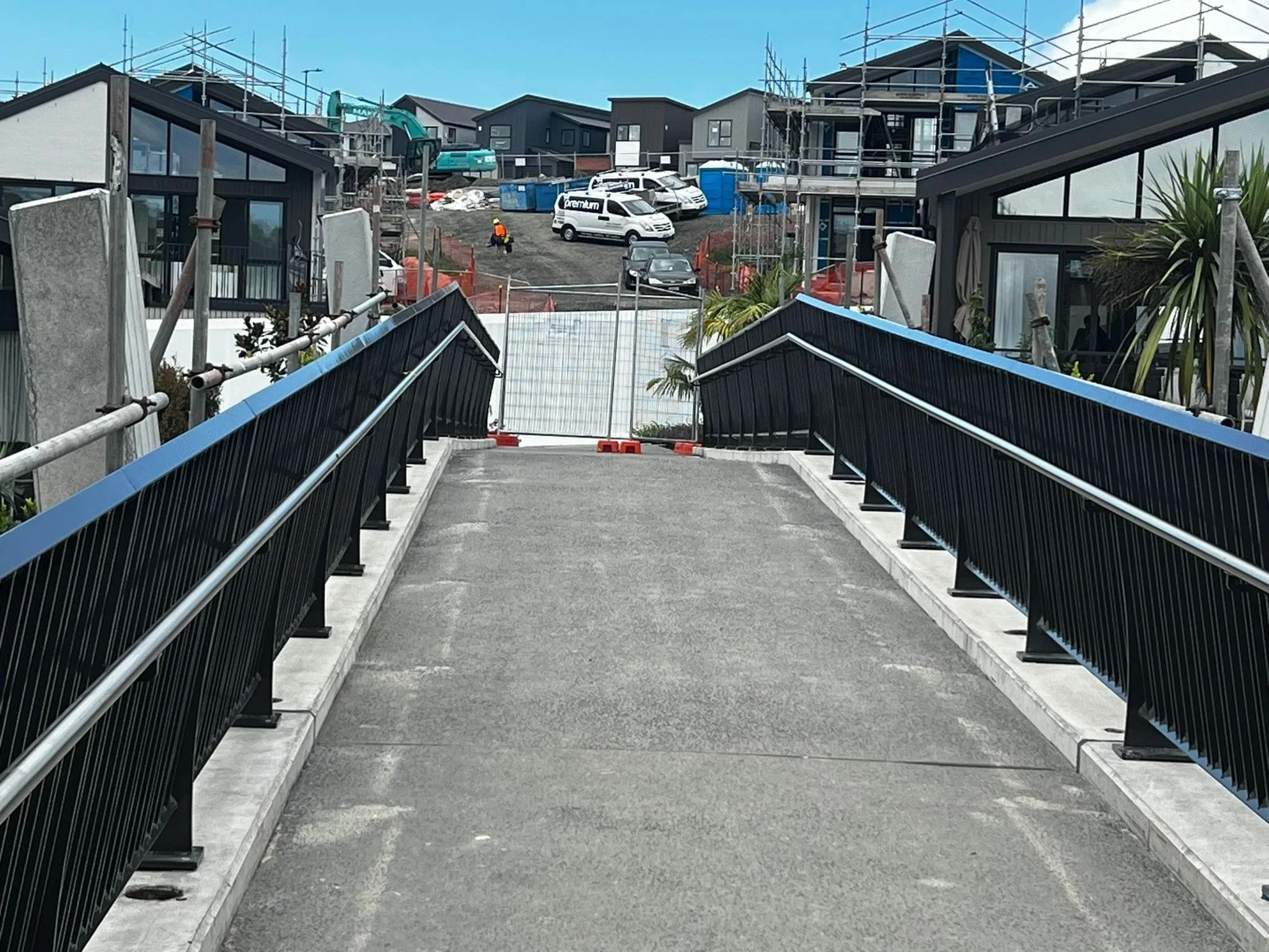 View of a driveway with steel balustrades lining the edges
