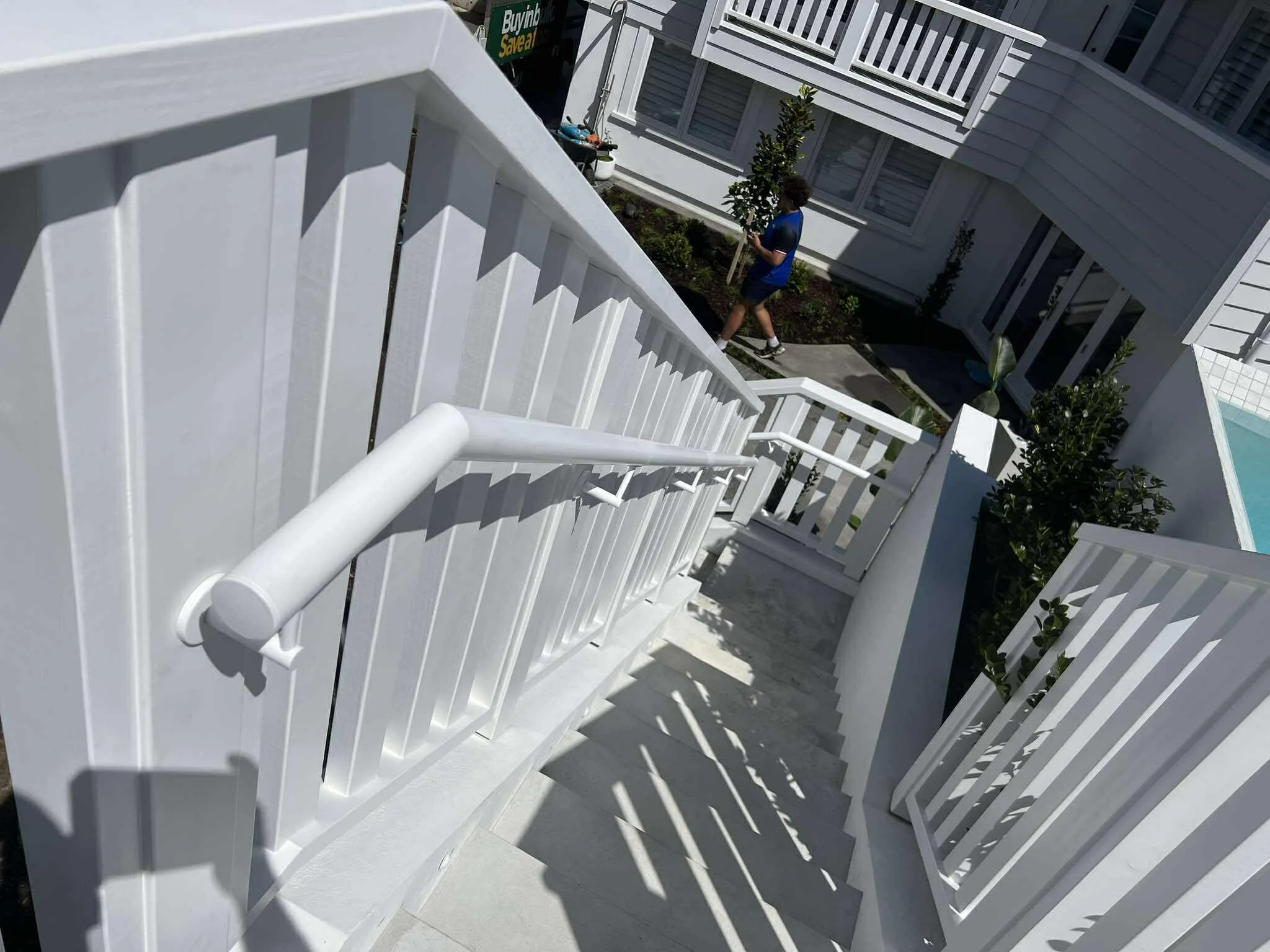 Stainless steel handrails powder-coated white outside a house in Milford