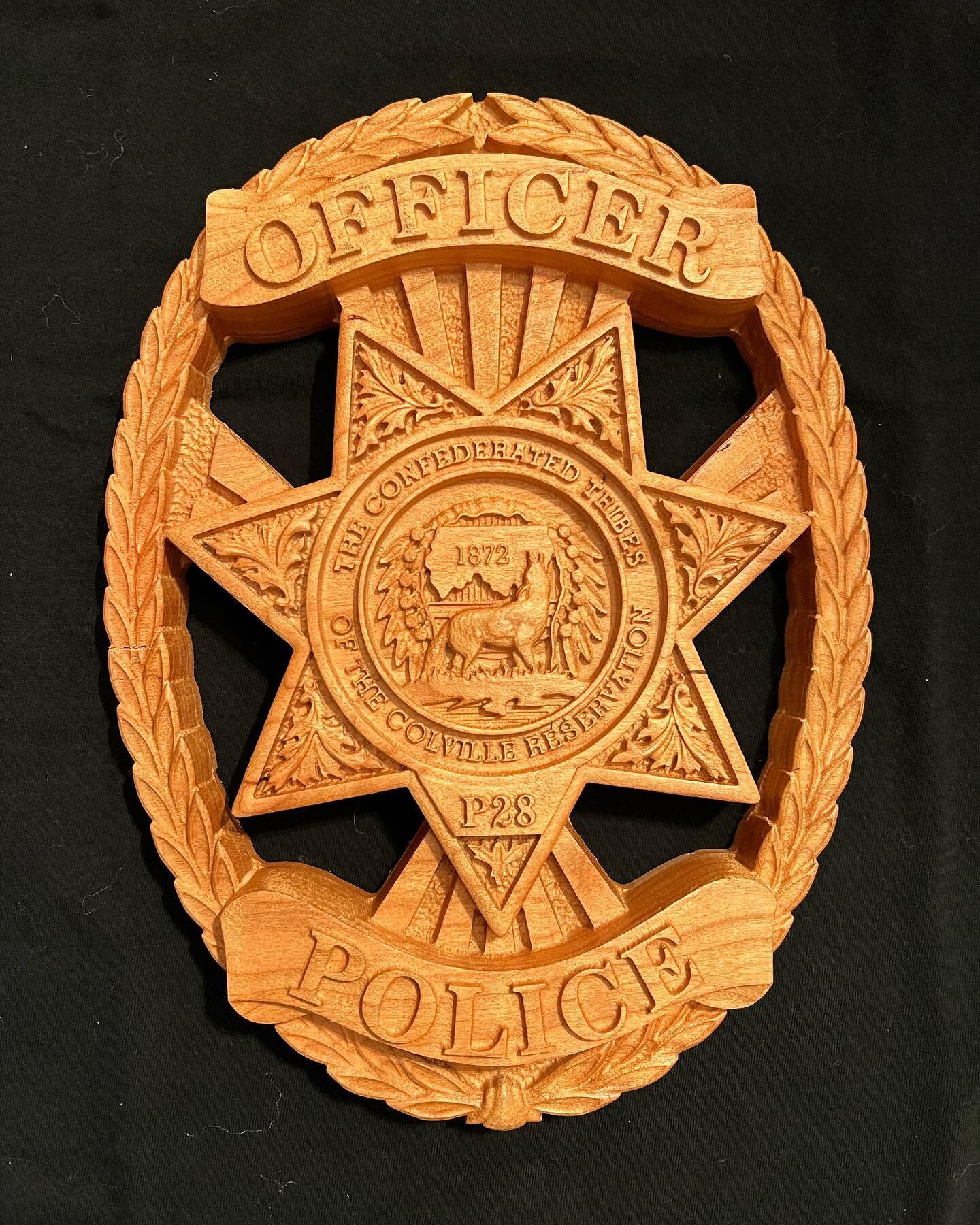 Colville Confederated Tribal Police badge carved in cherry. The young man who received this badge graduated from the Criminal Justice Training Center yesterday.  This badge was a gift from a very proud Mom.