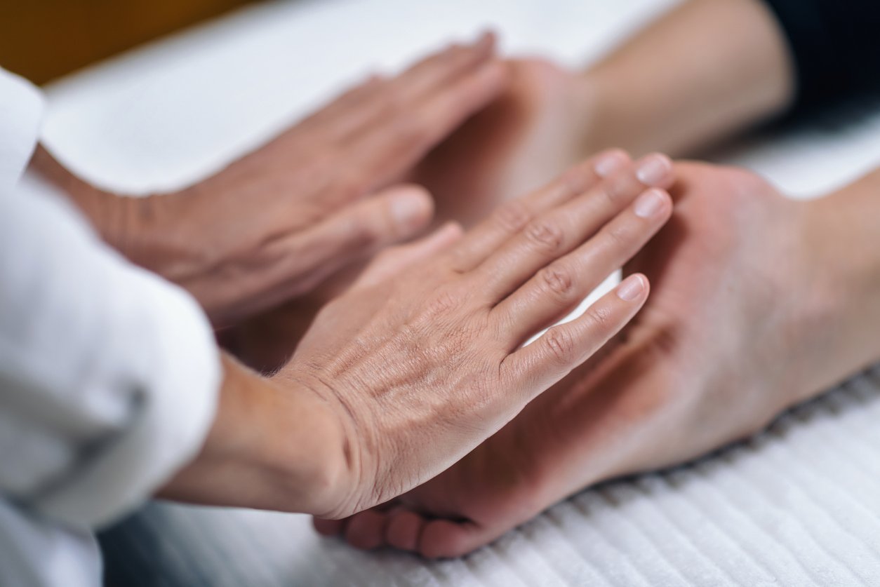 client receiving Reiki healing session