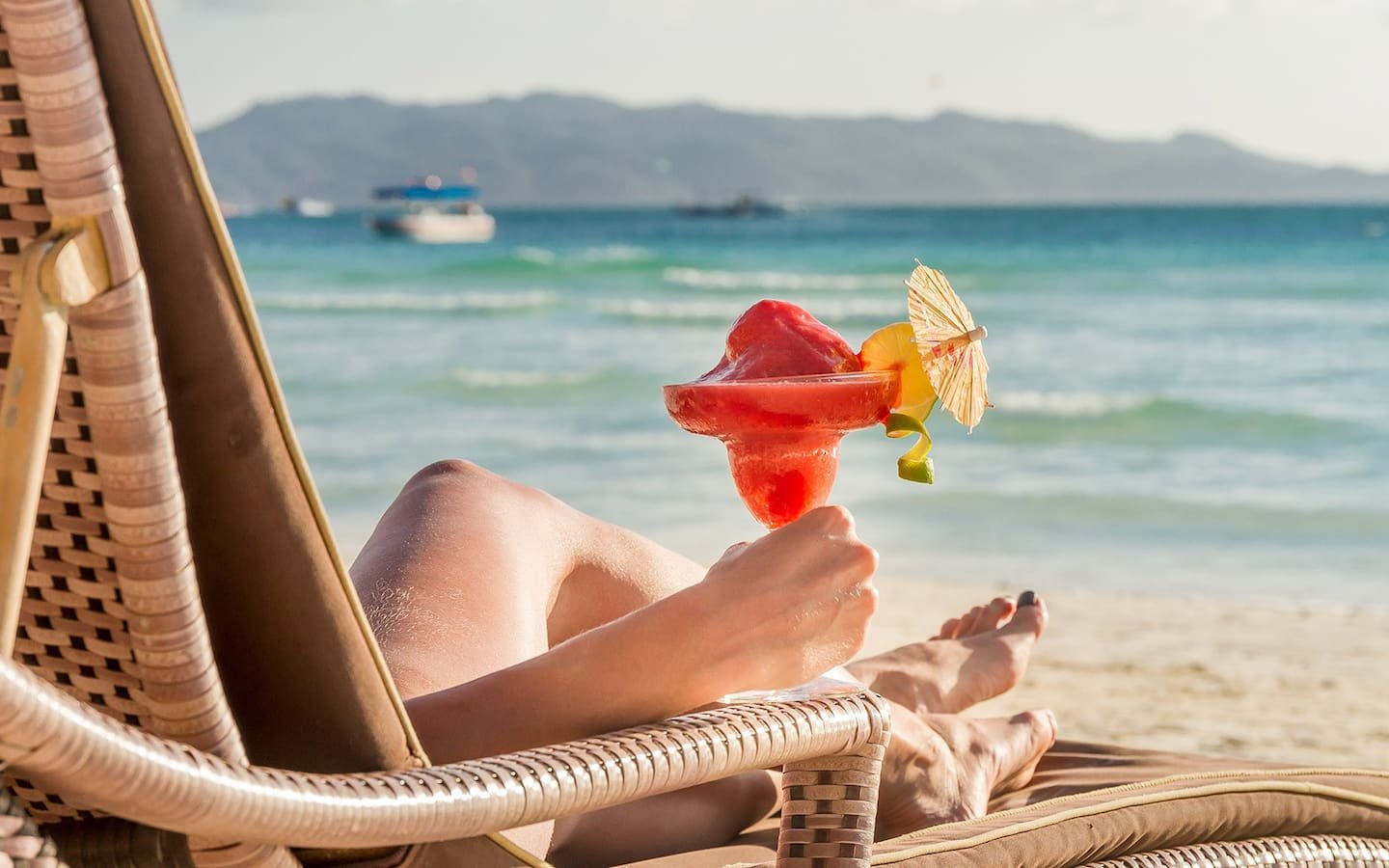 Woman beachside, relaxing during individual time on retreat