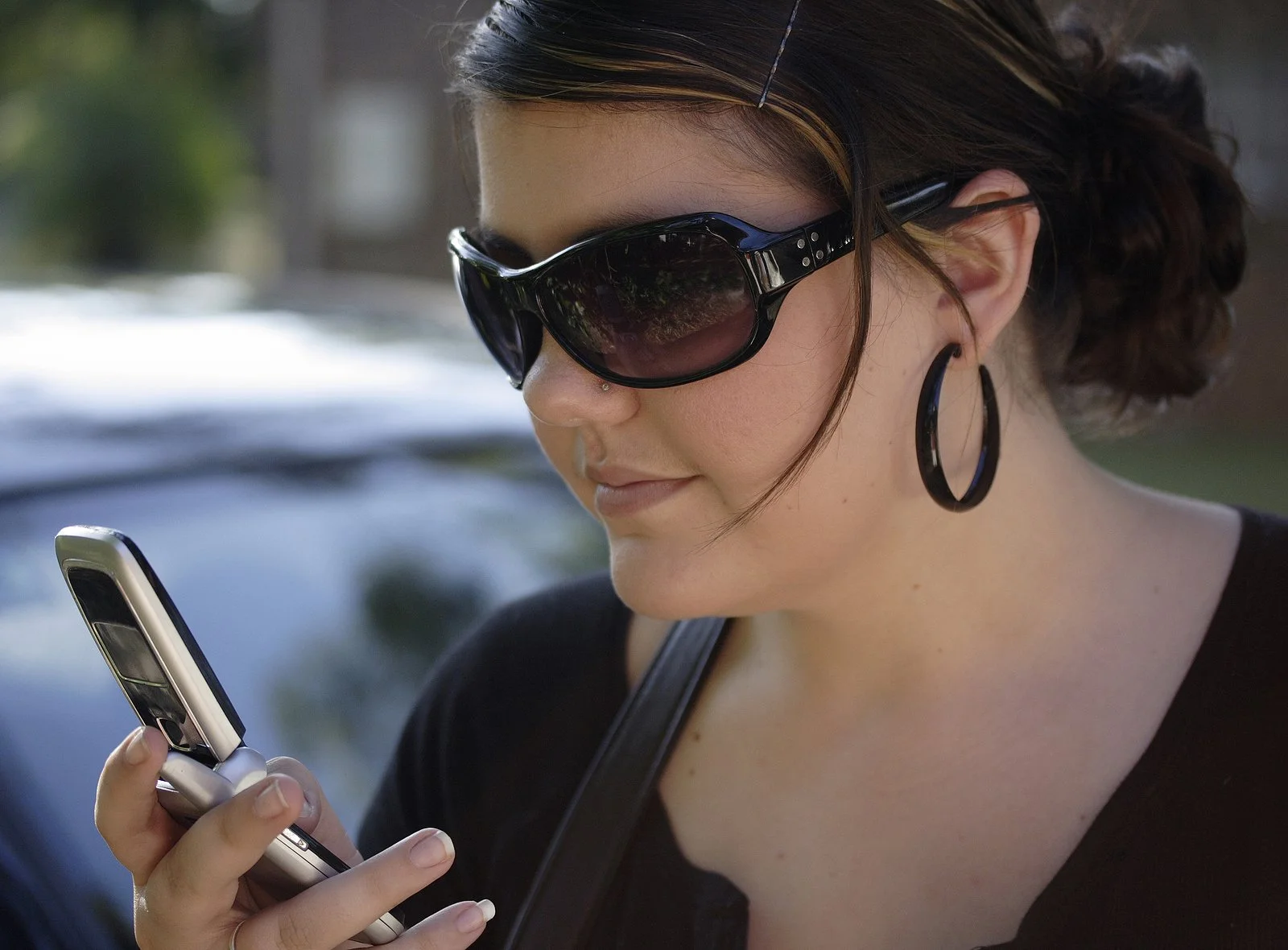 bigstock-Looking-At-Her-Cell-Phone-587833.jpg
