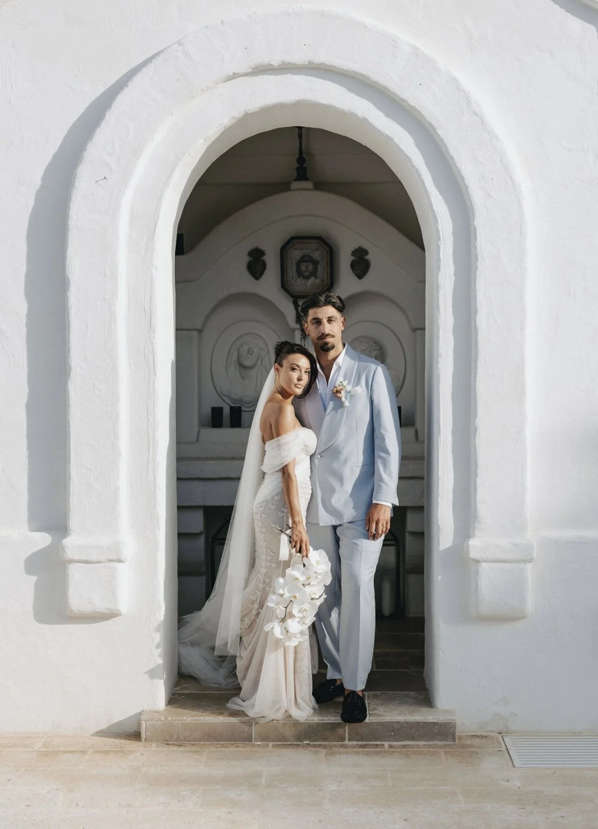 Destination wedding couple at Masseria Borgo Ritella in Puglia, Italy, showcasing elegant, natural bridal makeup.