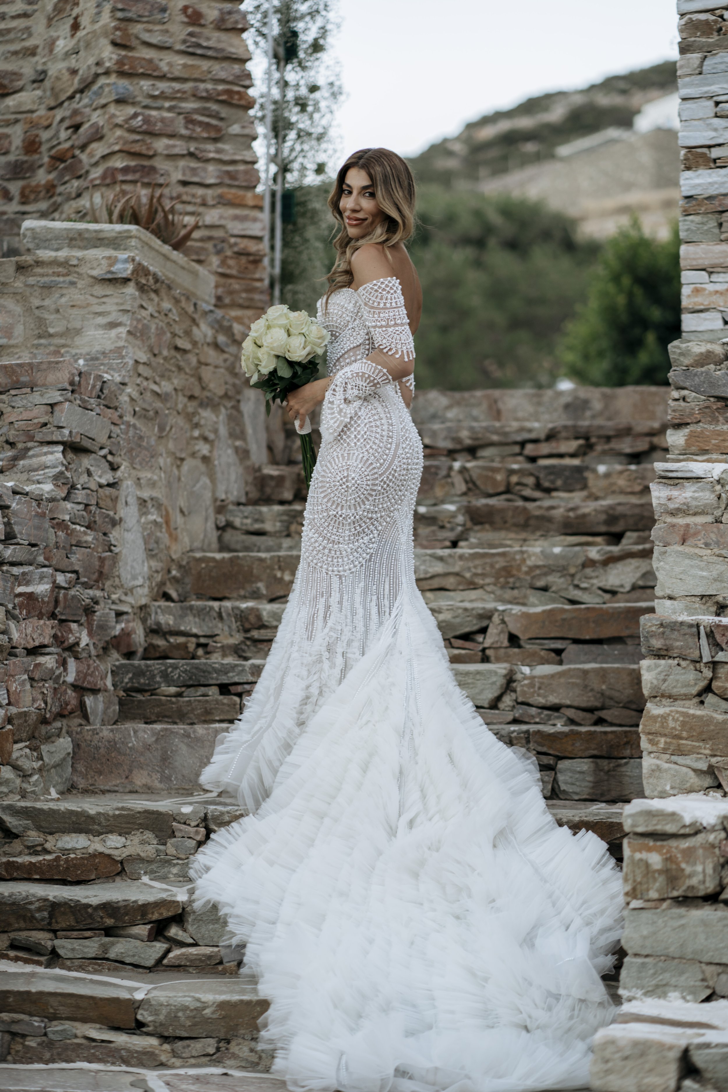 Bride wearing a Leah Da Gloria wedding dress with soft, sculpted bridal makeup in Sifnos, Greece.