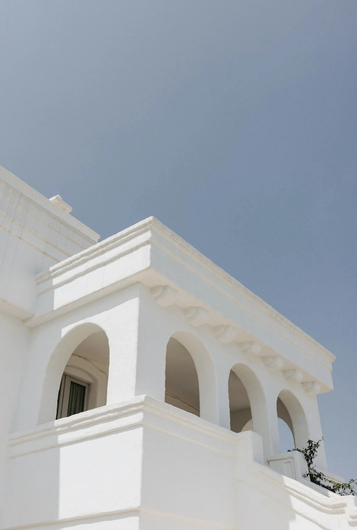 Mediterranean white-stone architecture at Masseria Borgo Ritella, a luxury wedding venue in Puglia, Italy.