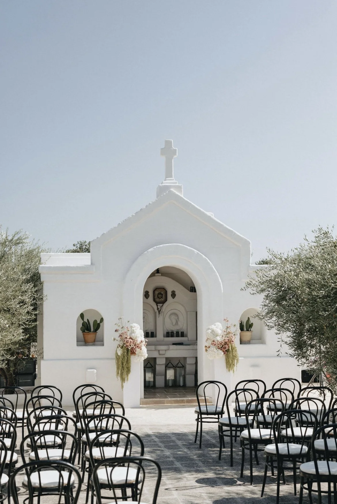 Outdoor wedding ceremony at Masseria Borgo Ritella in Fasano, Puglia, Italy, a Mediterranean destination wedding venue.