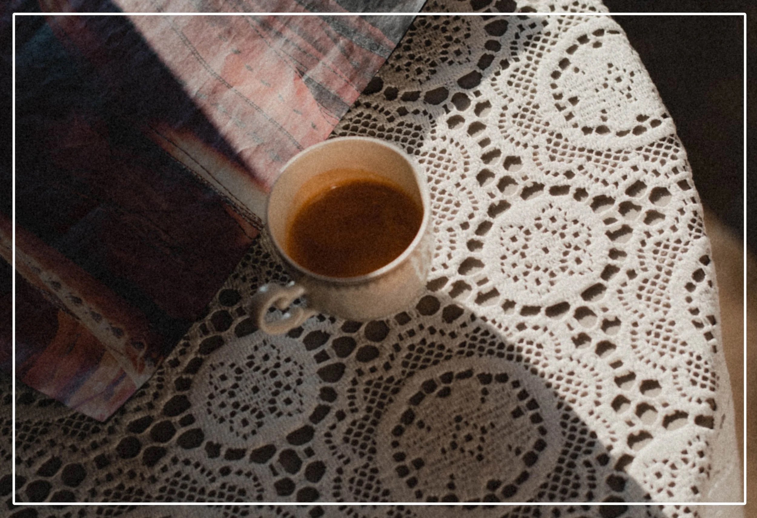 Coffee cup on lace table cloth