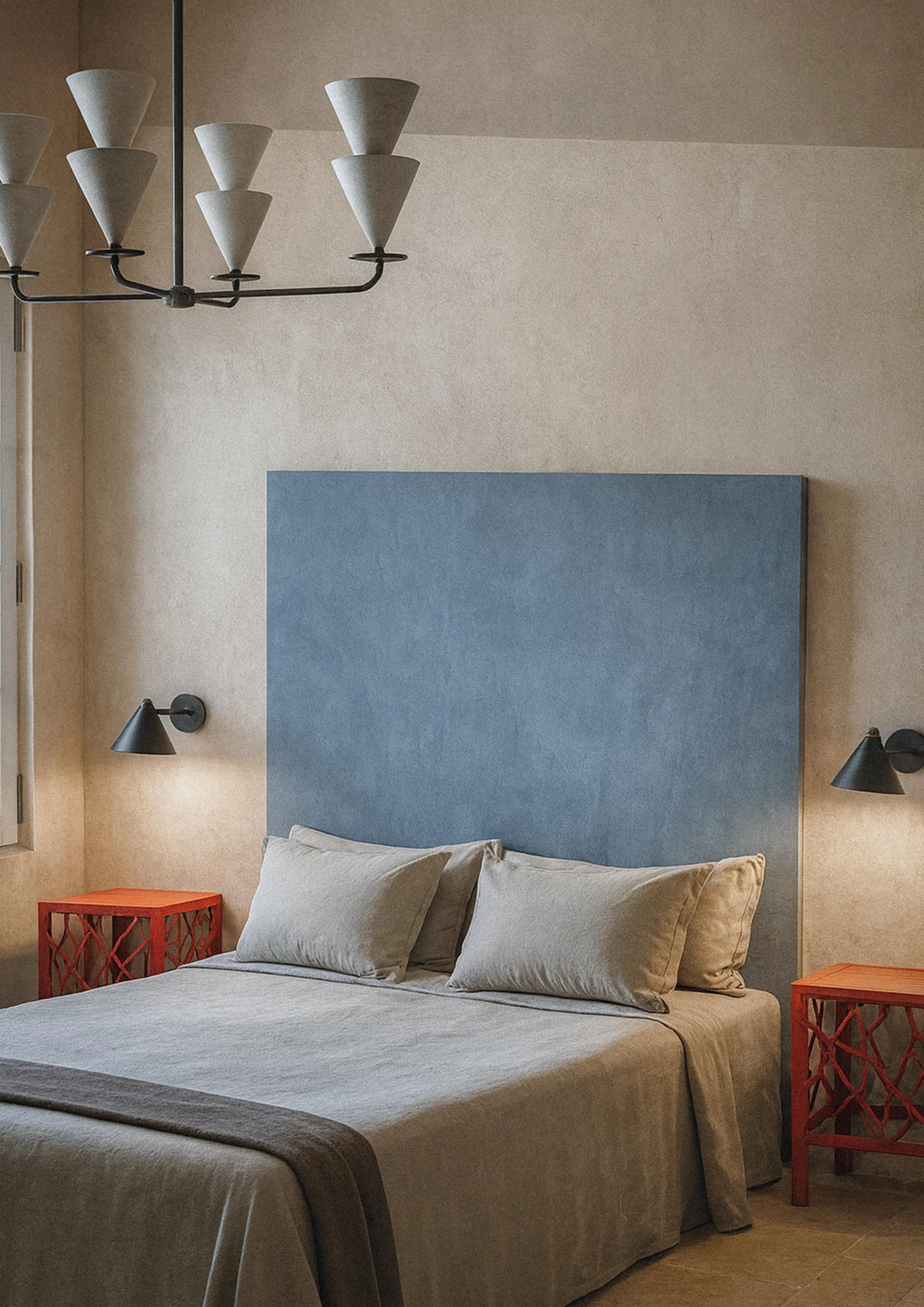 zoomed in Modern bedroom interior with blue headboard, neutral bedding, soft natural light, tiled floor, and contemporary furnishings