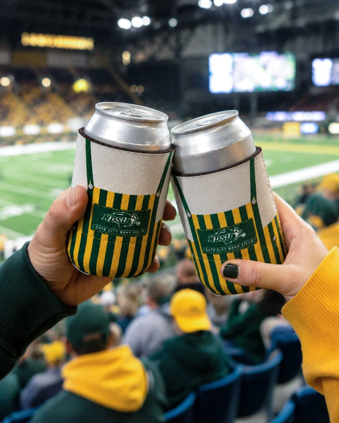 Can koozie designed to evoke the look of fan apparel worn during games.