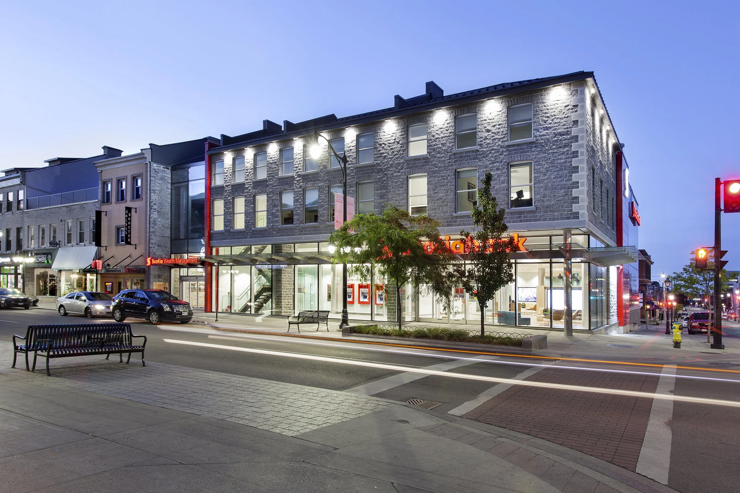 Downtown Kingston at night exterior of Scotia Bank project by Shoalts and Zaback Architects.