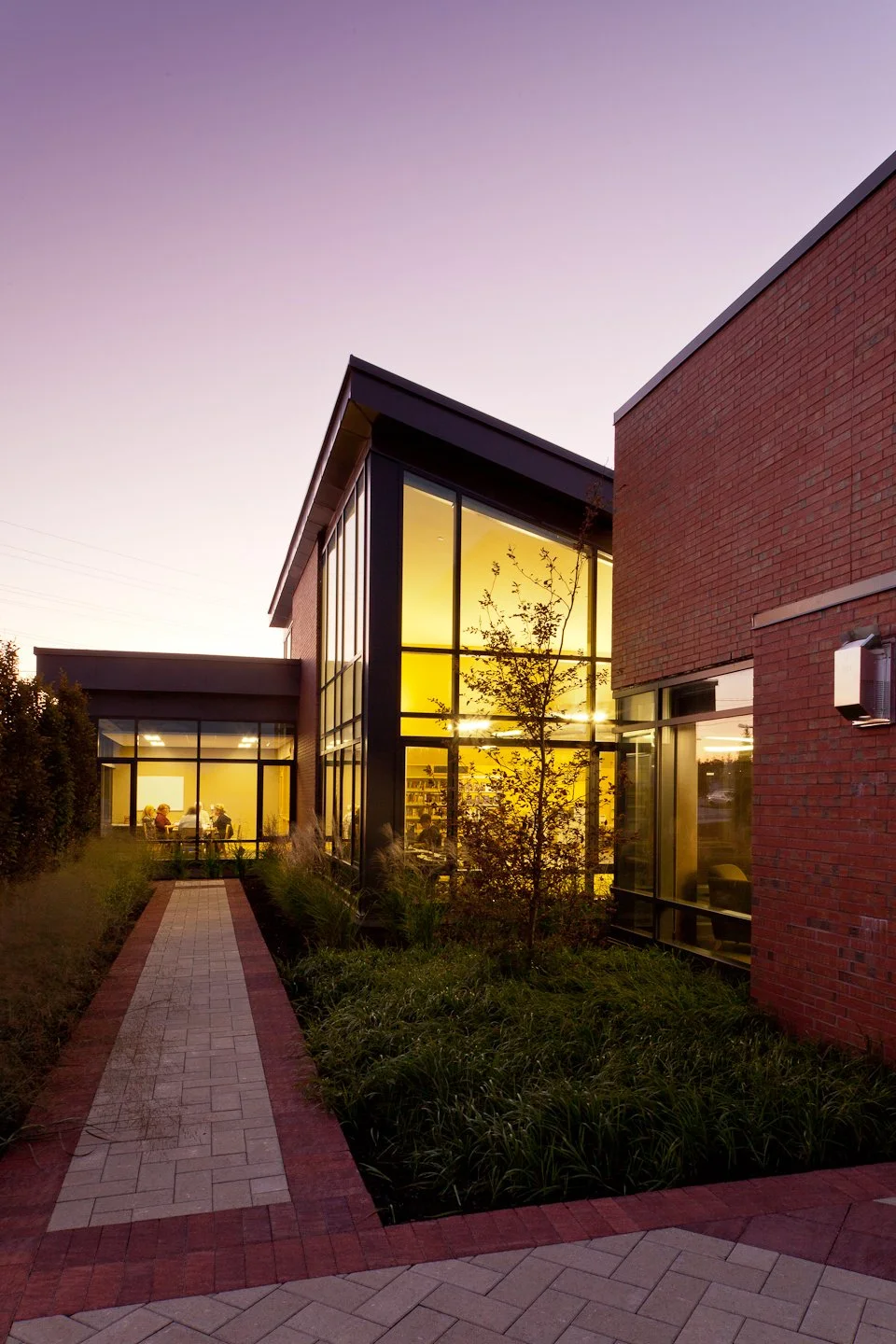 Scugog Memorial Public Library exterior renovation at dusk by Shoalts and Zaback Architects.