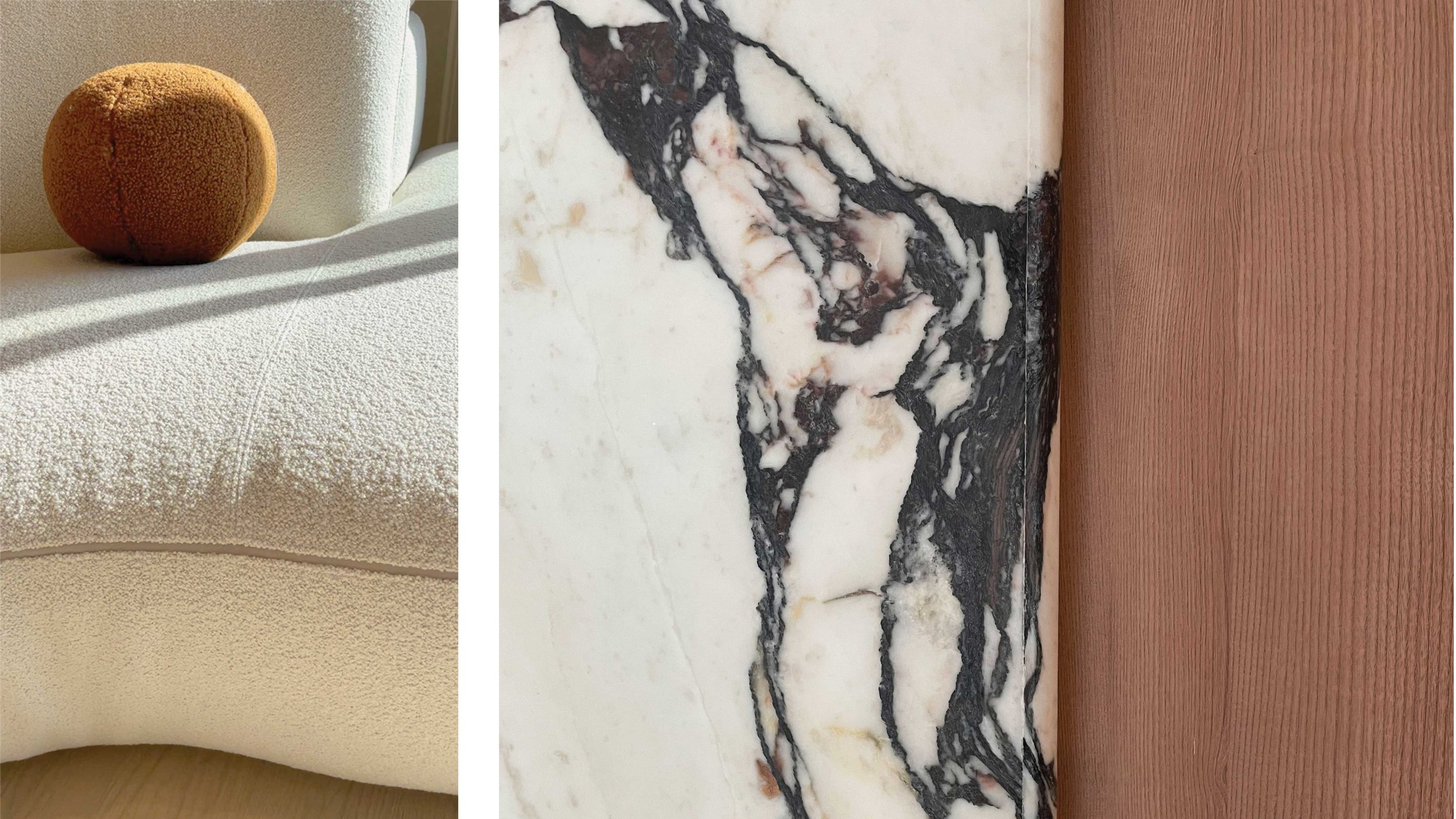 Close-up of a textured cream-colored sofa with an orange round cushion, a marble surface with black and white veining, and a wooden panel in the background.