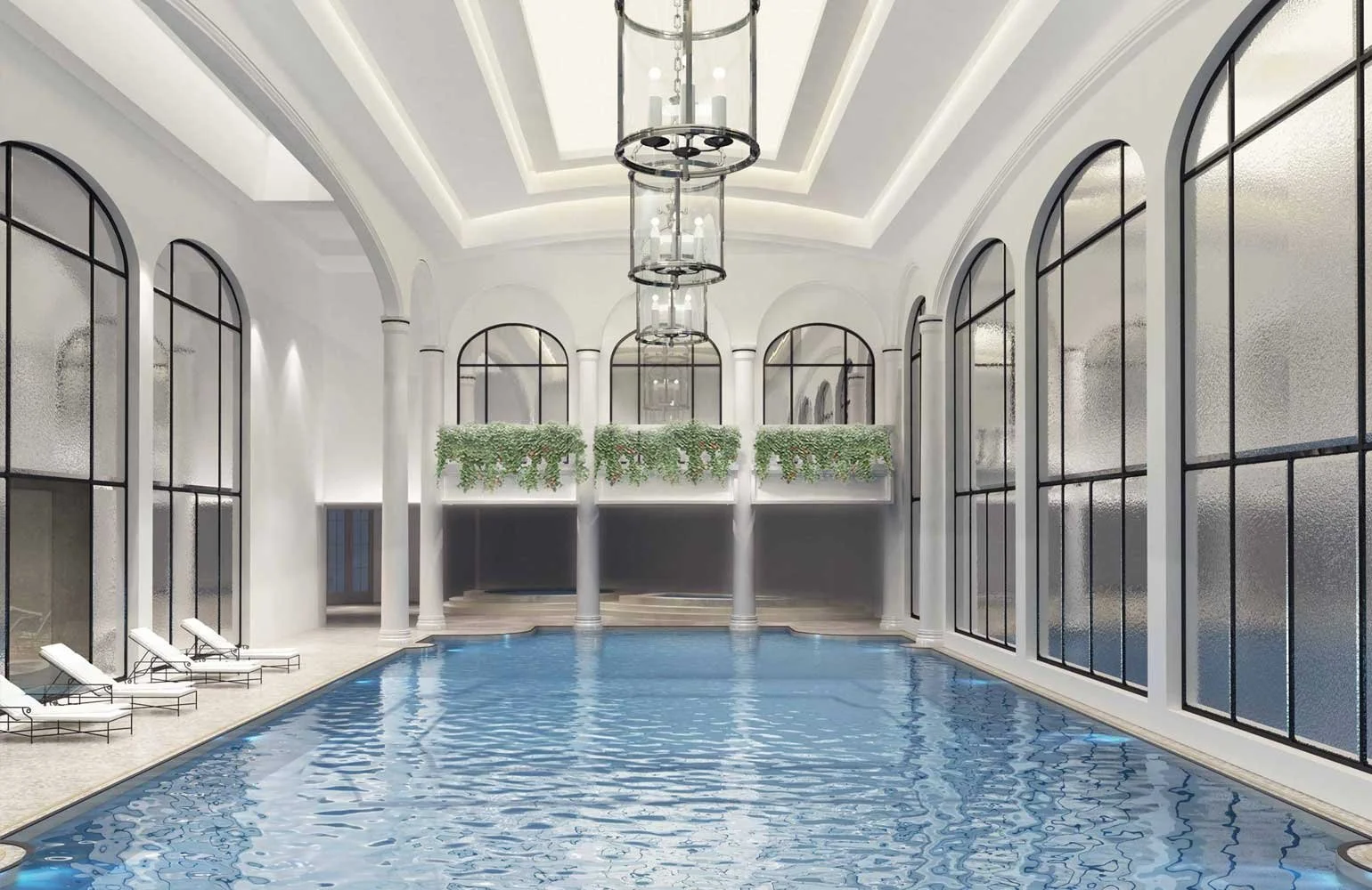 Indoor luxurious swimming pool inside a grand building with large arched windows, potted plants, and white columns.