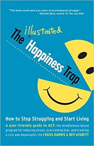 Book cover of "The Illustrated Happiness Trap" by Russ Harris and Bev Aisbett, featuring a blue background with a yellow smiling face and text promoting mindfulness and ACT therapy.