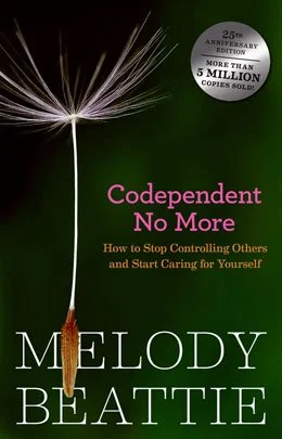 Cover of "Codependent No More" by Melody Beattie featuring a dandelion seed against a dark background, with text about controlling others and self-care.