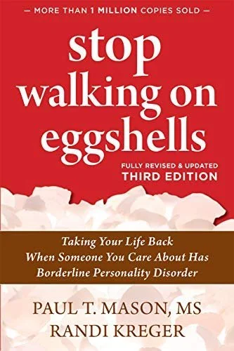 Book cover of 'Stop Walking on Eggshells' by Paul T. Mason, MS and Randi Kreger, third edition, featuring a red and white design with floral imagery at the bottom.