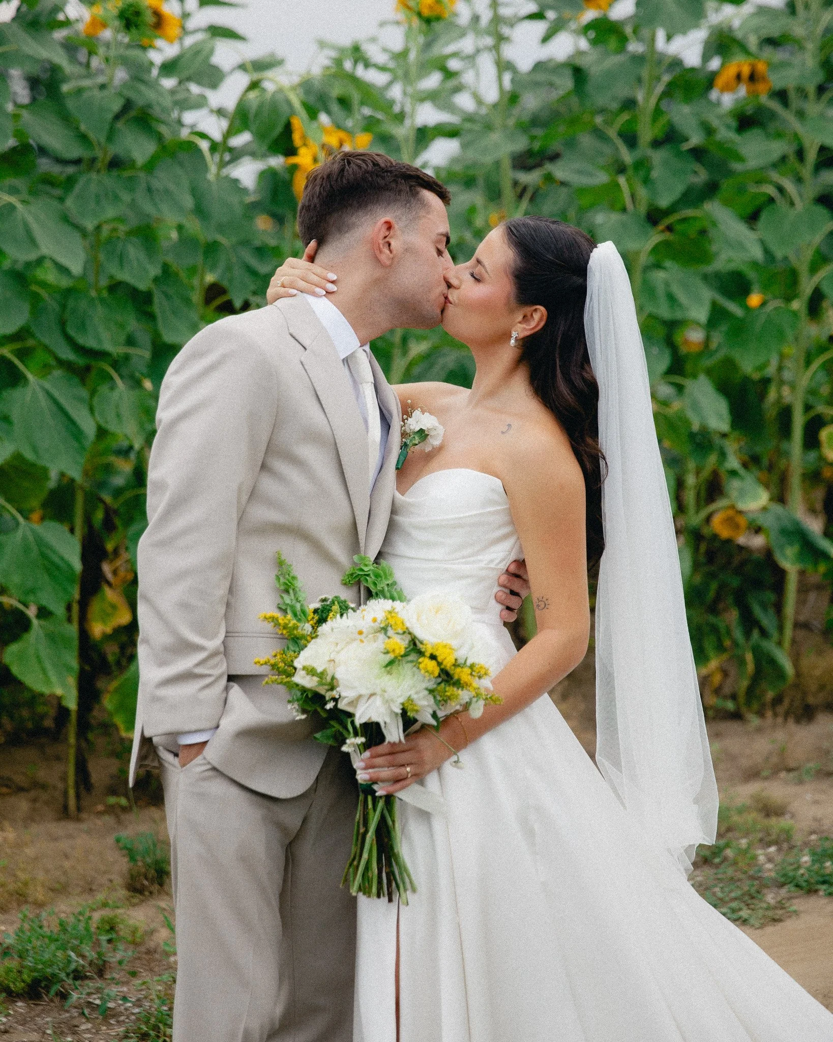 Bride and groom kissing in a sunflower field, North Jersey wedding photography