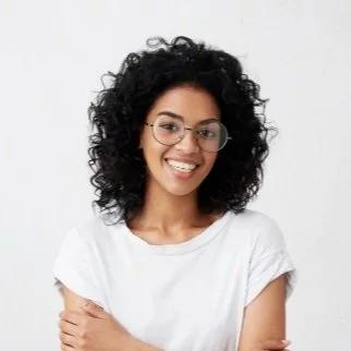 indoor-shot-beautiful-happy-african-american-woman-smiling-cheerfully-keeping-her-arms-folded-relaxing-indoors-after-morning-lectures-university_273609-1270.jpg