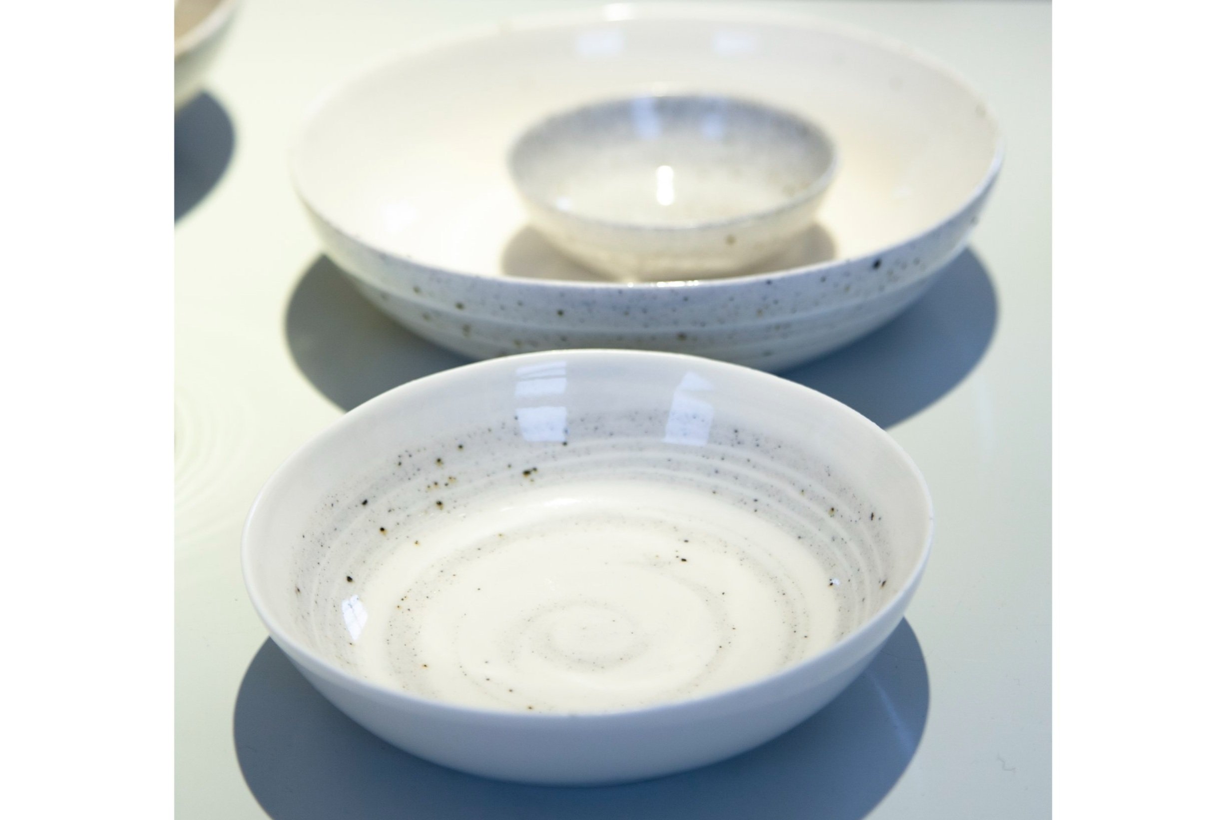 Porcelain stacking bowls with iron inclusions