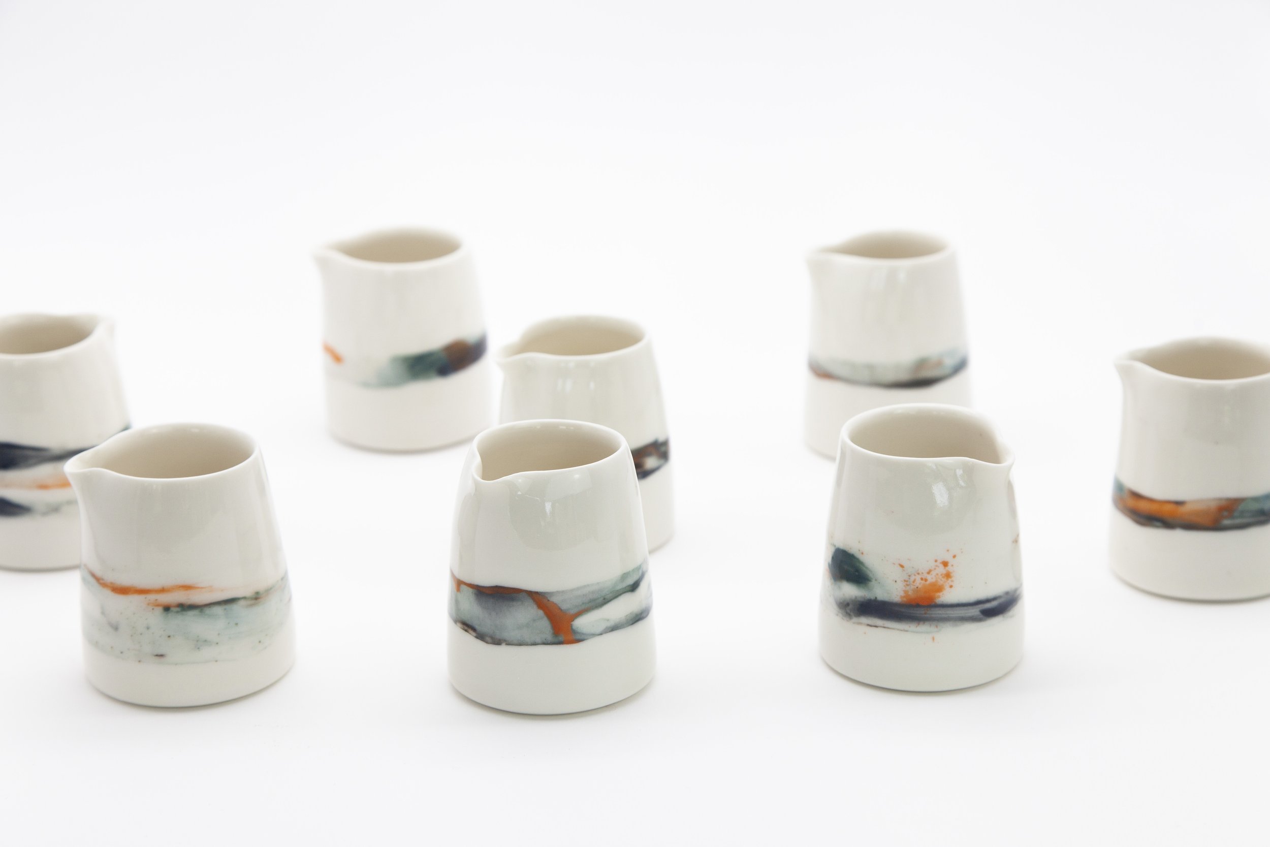 Small Porcelain Pourers with hand-painted Seascape Decoration