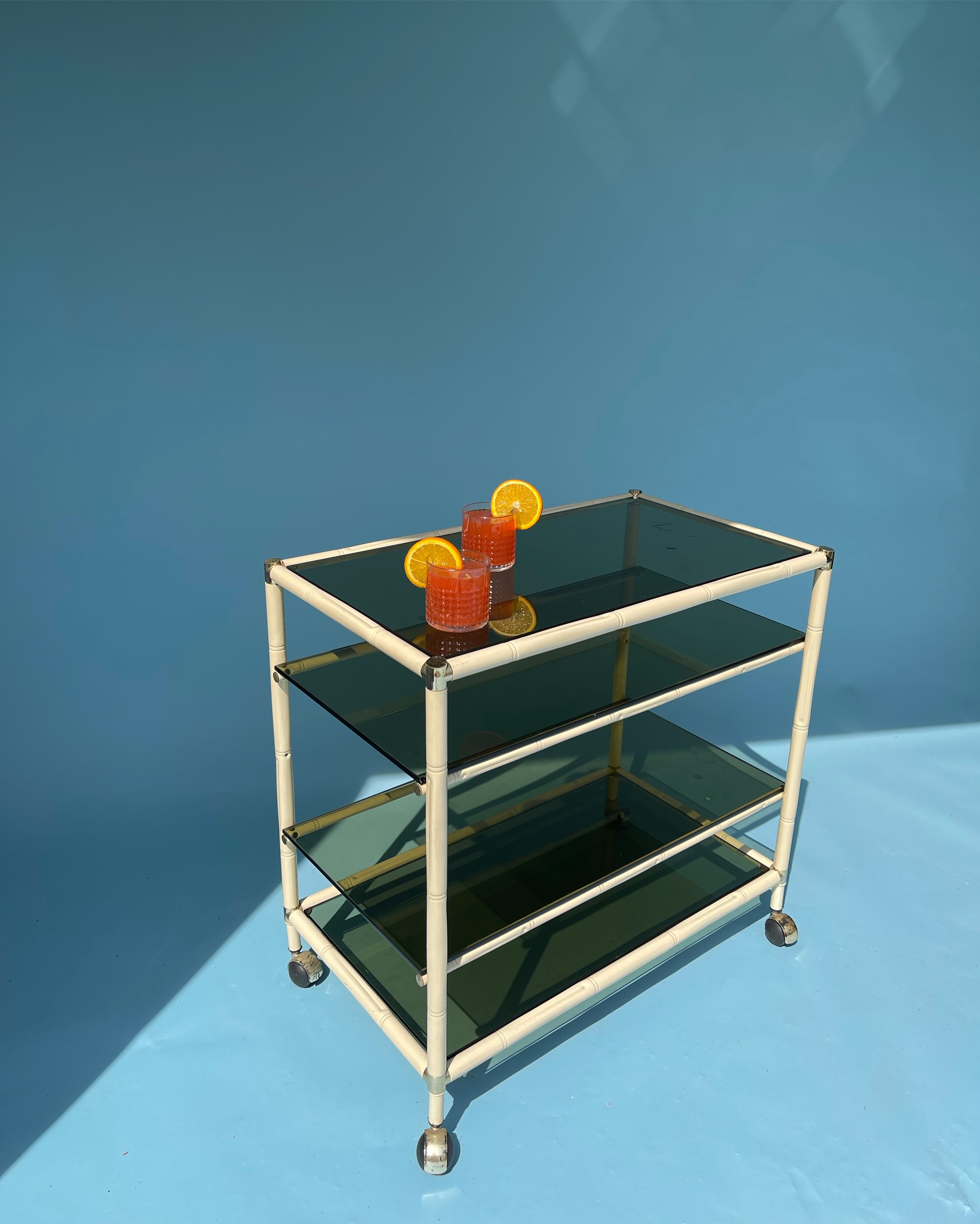 1970s smoked glass, brass and enamel trolley