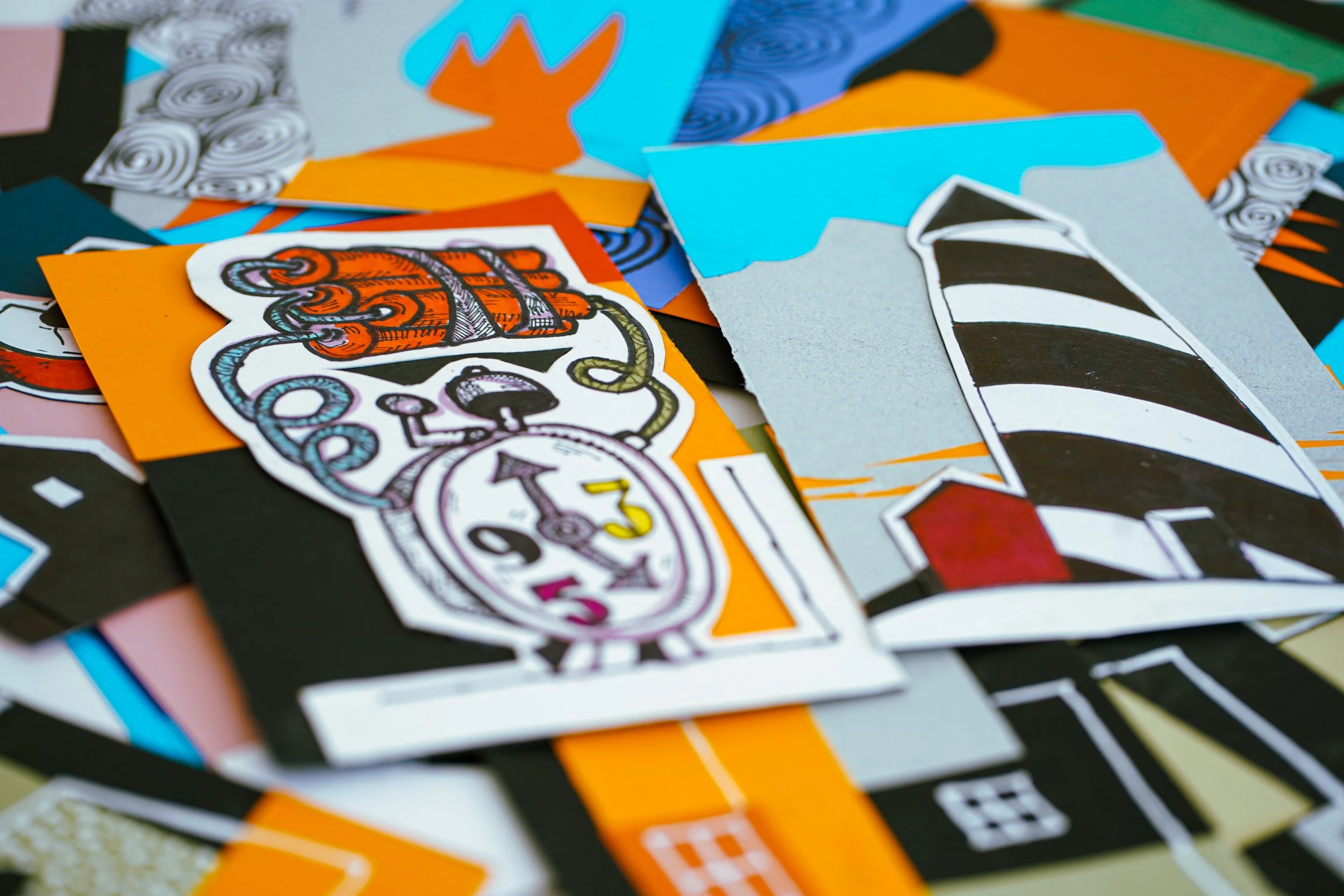 Photo of physical original drawings and collages before digitization.