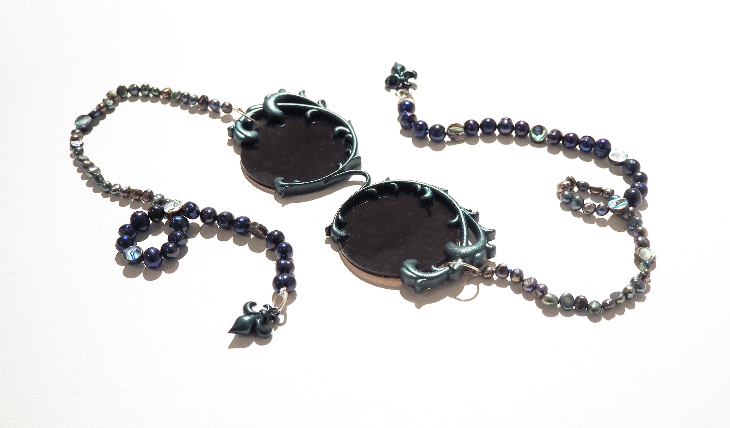 Ornamental Spectacles,
Painted Resin, Pearls, Sterling Silver, Thread,
16 1/4" x 5 1/2" x 3/8"
2022