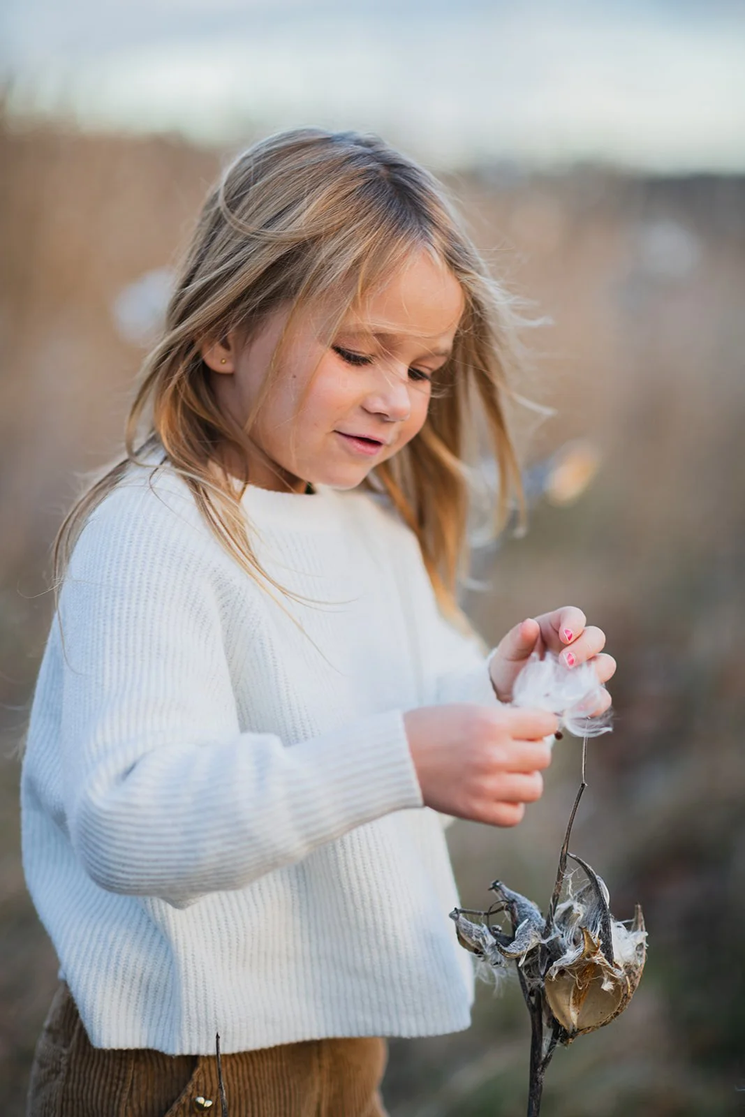 girl holding flower in maine