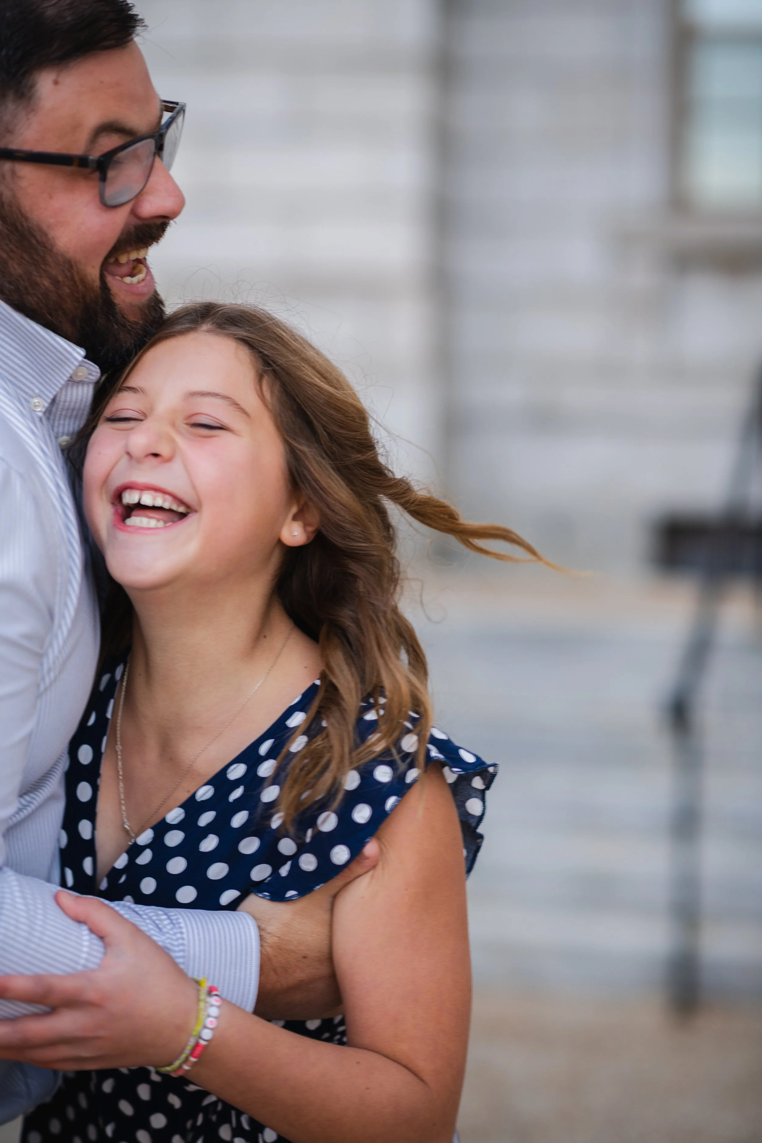 Dad holding daughter in downtown portland
