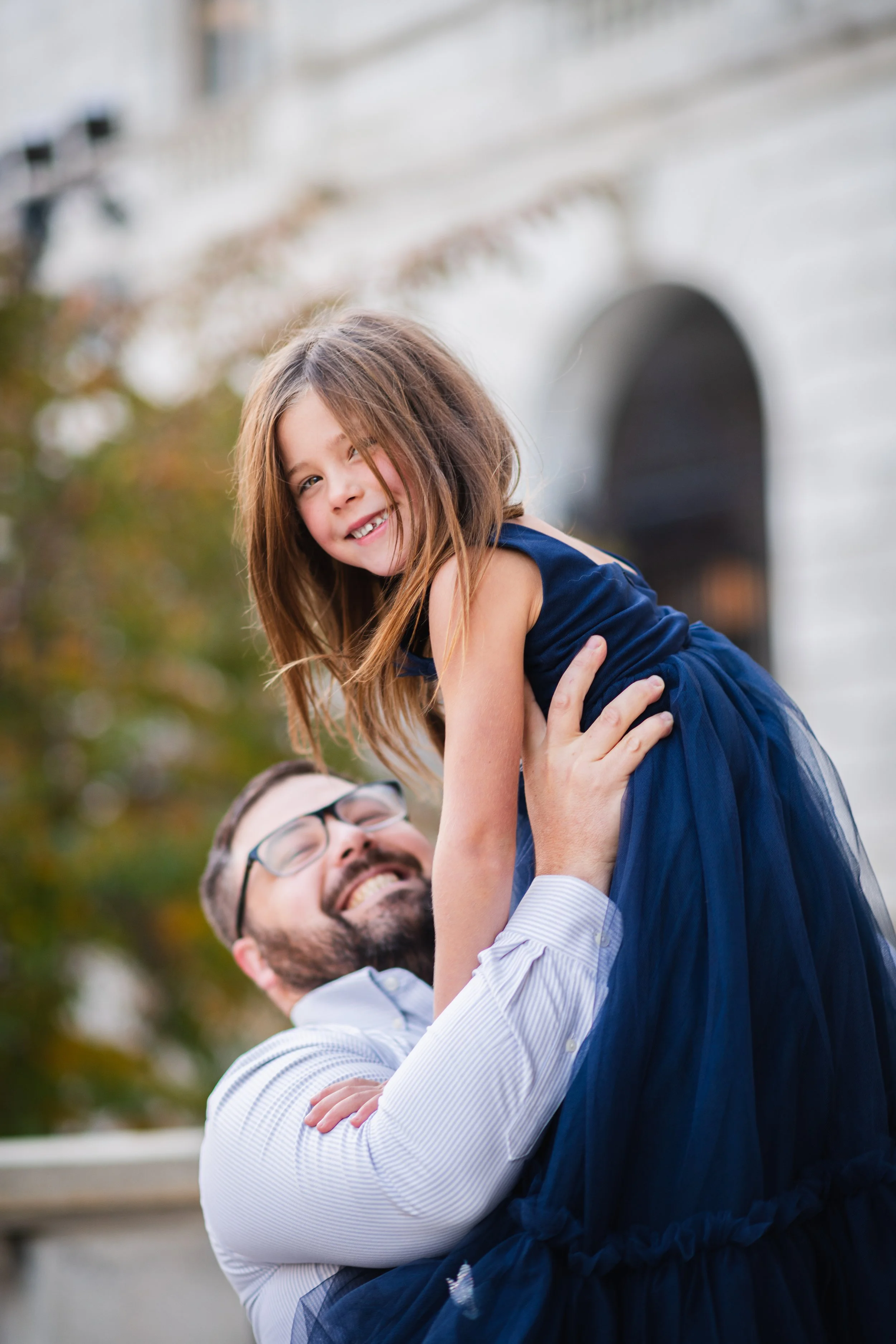 Dad holding daughter in downtown Portland