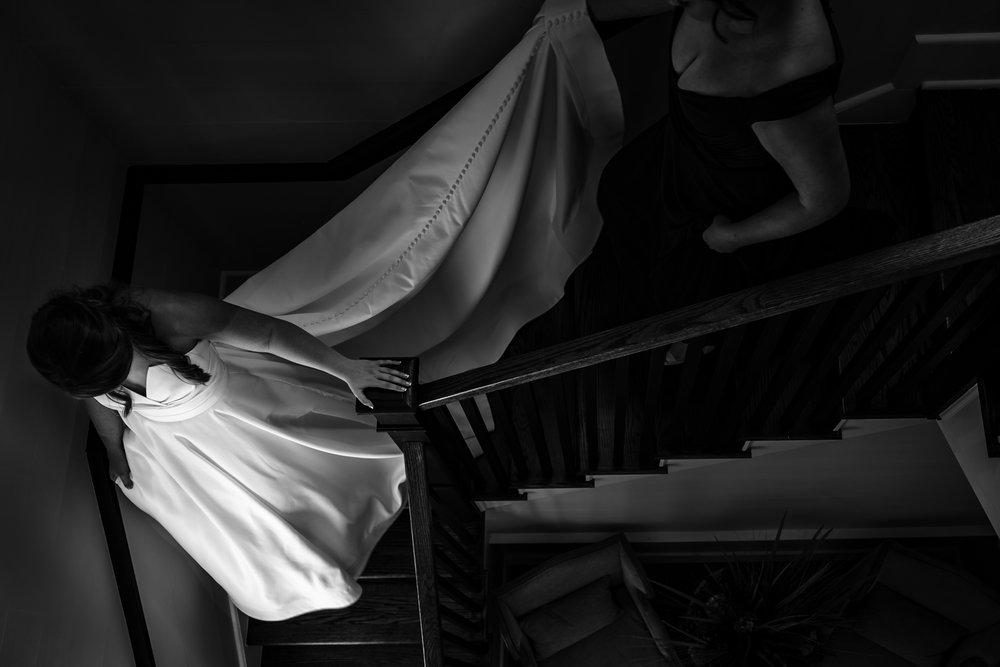black-and-white-candid-bride-on-hazlehurst-house-stairs-0004.JPG