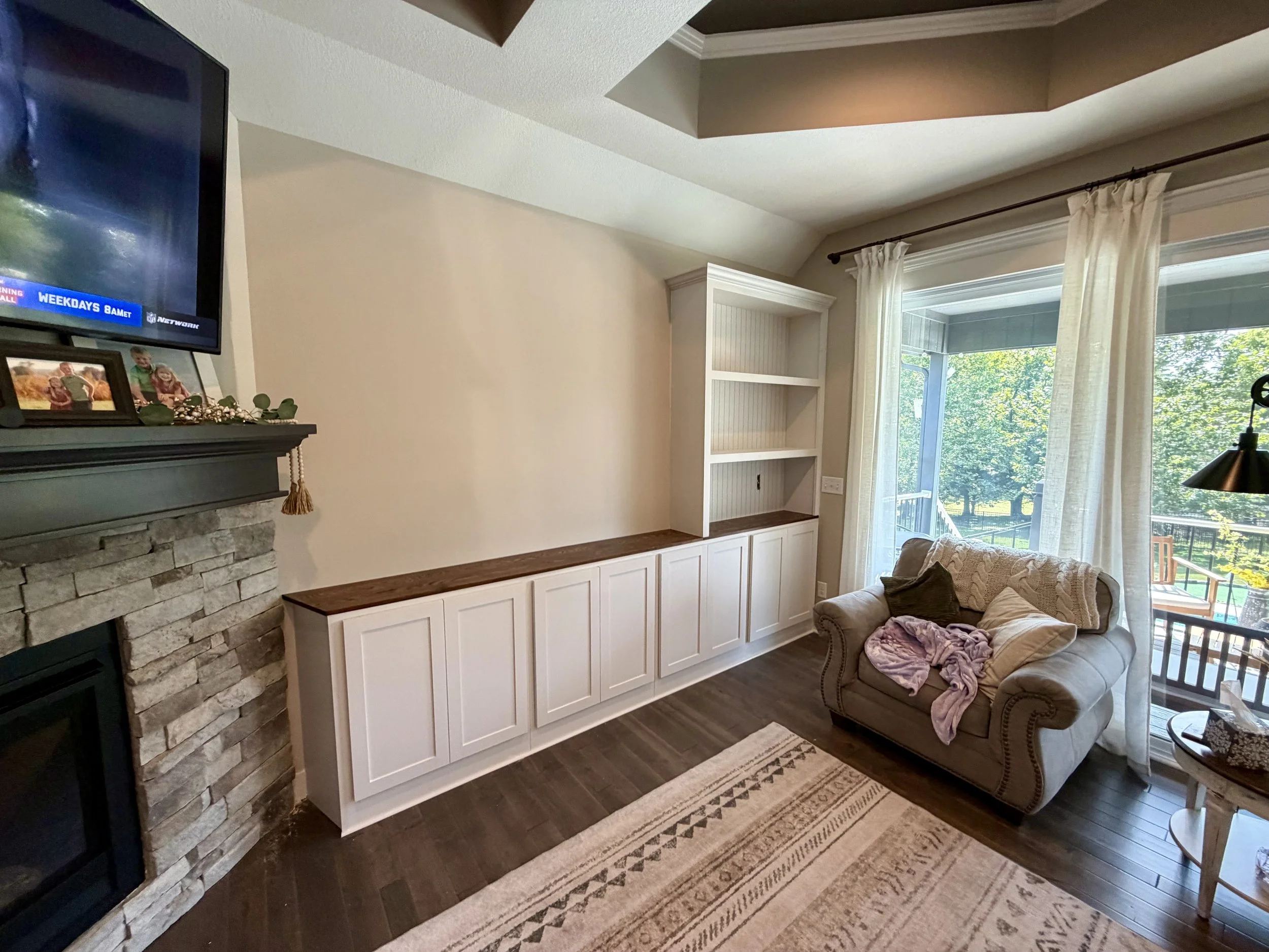 Custom Entertainment Center Built Ins white cabinets and stained oak top